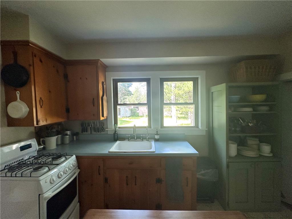 10 Kizer Pond Road Lake Ariel, PA 18436 - Photo 11 of 48 A quaint kitchen offers a welcoming culinary space, complete with wooden cabinetry and a classic gas range.