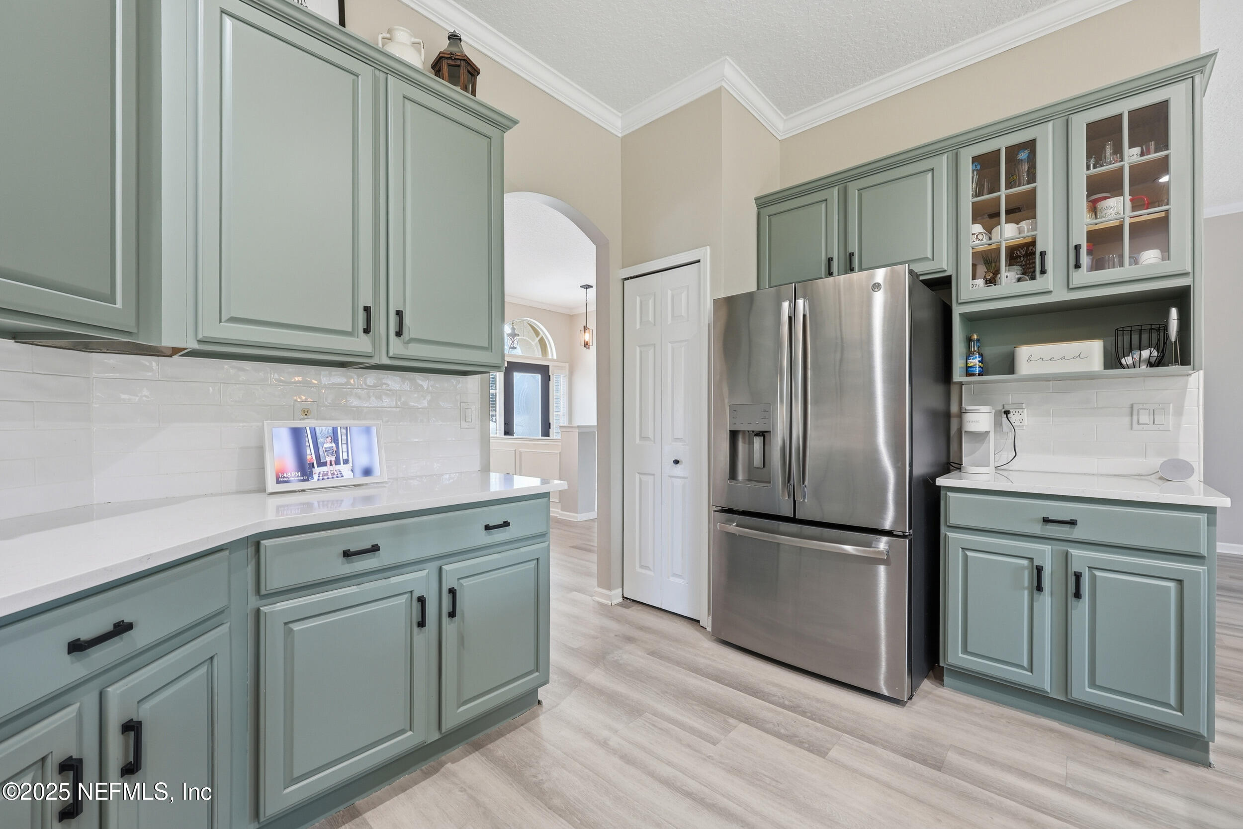 1605 Merroway Lane Ponte Vedra, FL 32081 - Photo 12 of 41 a kitchen with stainless steel appliances granite countertop a refrigerator and a sink