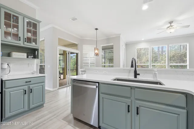 a kitchen with a sink stove and microwave