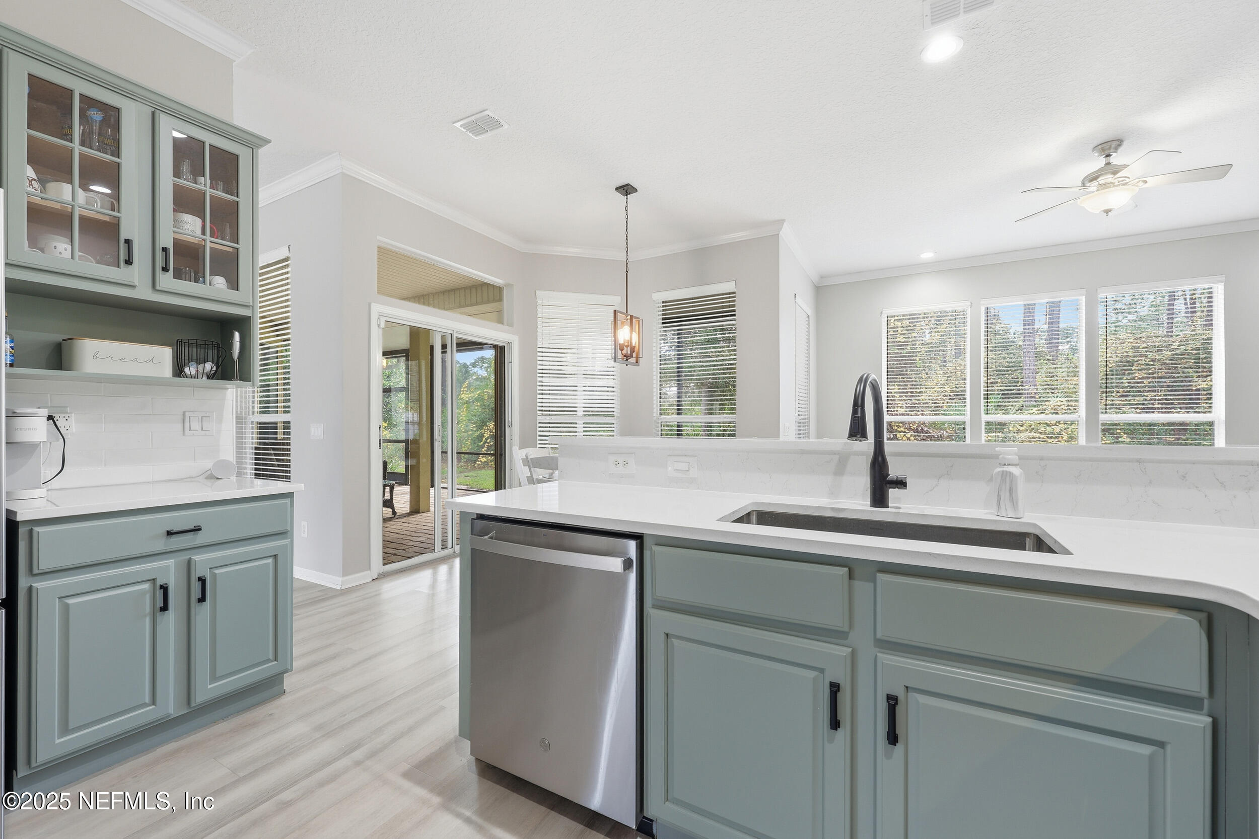 1605 Merroway Lane Ponte Vedra, FL 32081 - Photo 13 of 41 a kitchen with a sink and cabinets