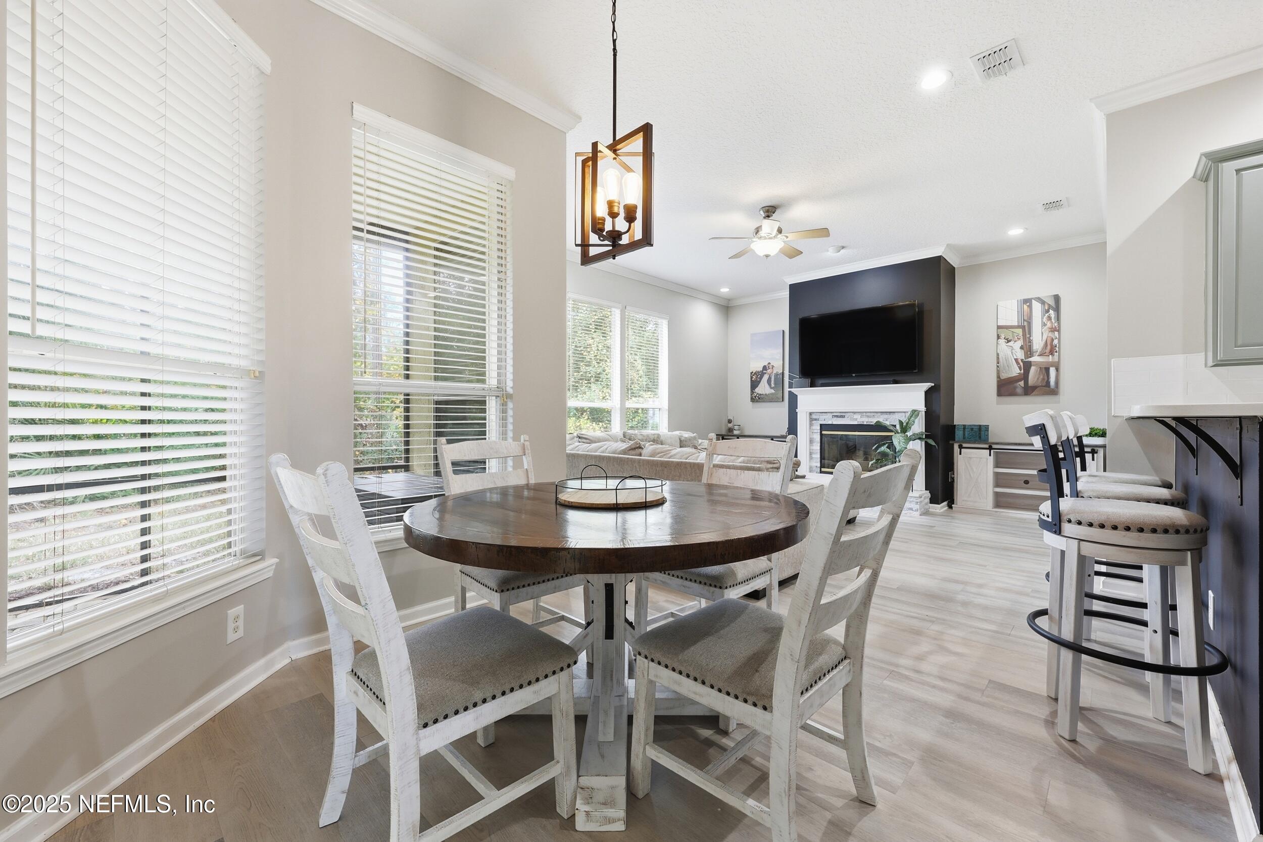 1605 Merroway Lane Ponte Vedra, FL 32081 - Photo 15 of 41 a view of a dining room with furniture and a flat screen tv