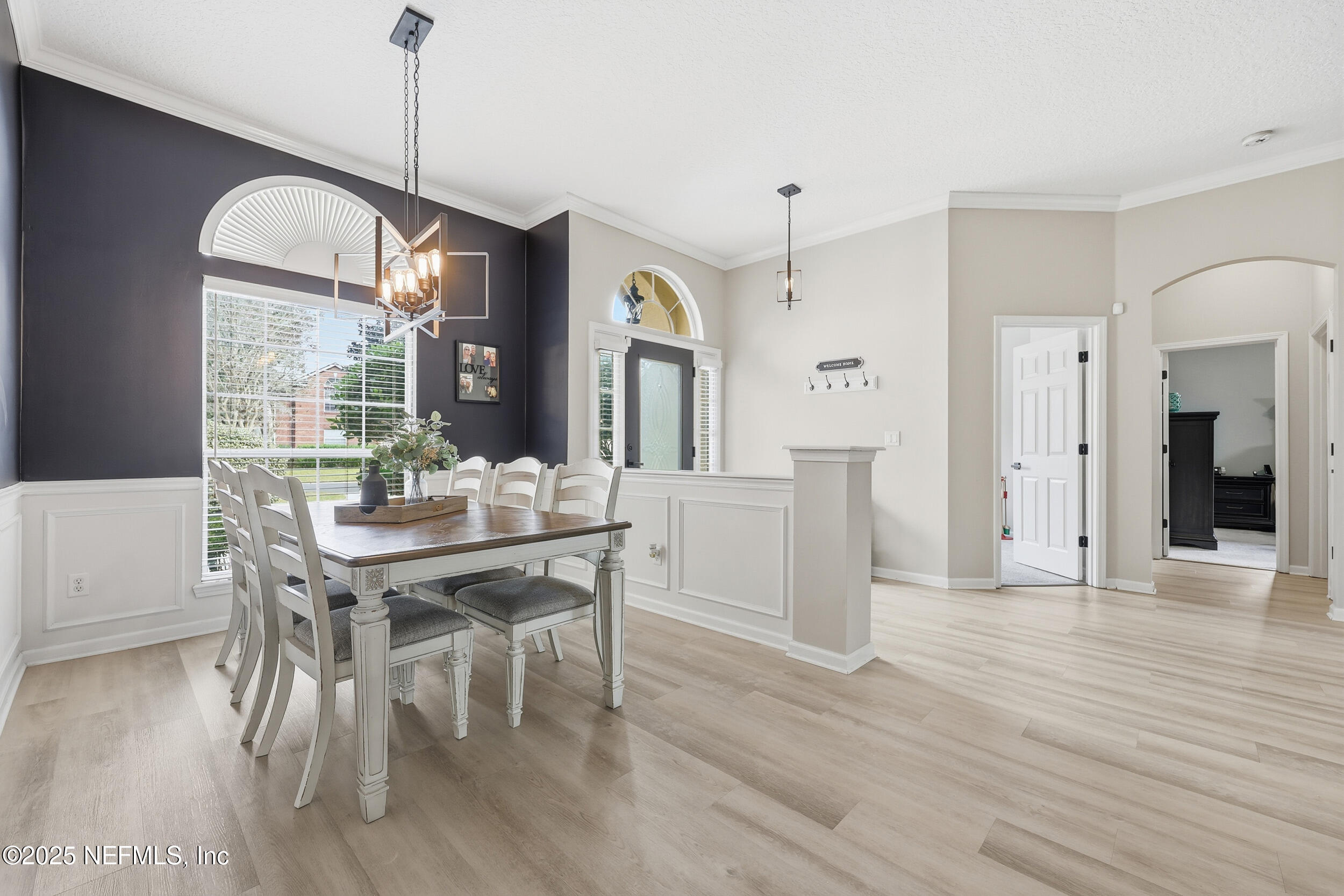 1605 Merroway Lane Ponte Vedra, FL 32081 - Photo 17 of 41 a view of a dining room with furniture window and wooden floor