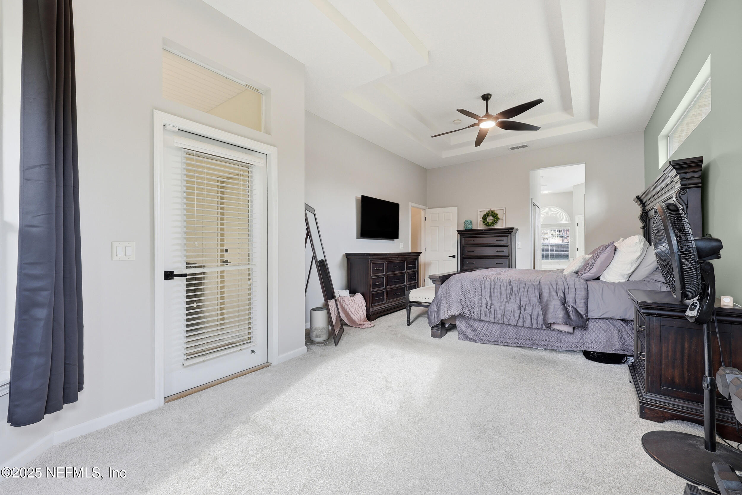 1605 Merroway Lane Ponte Vedra, FL 32081 - Photo 19 of 41 a bedroom with furniture and a flat screen tv