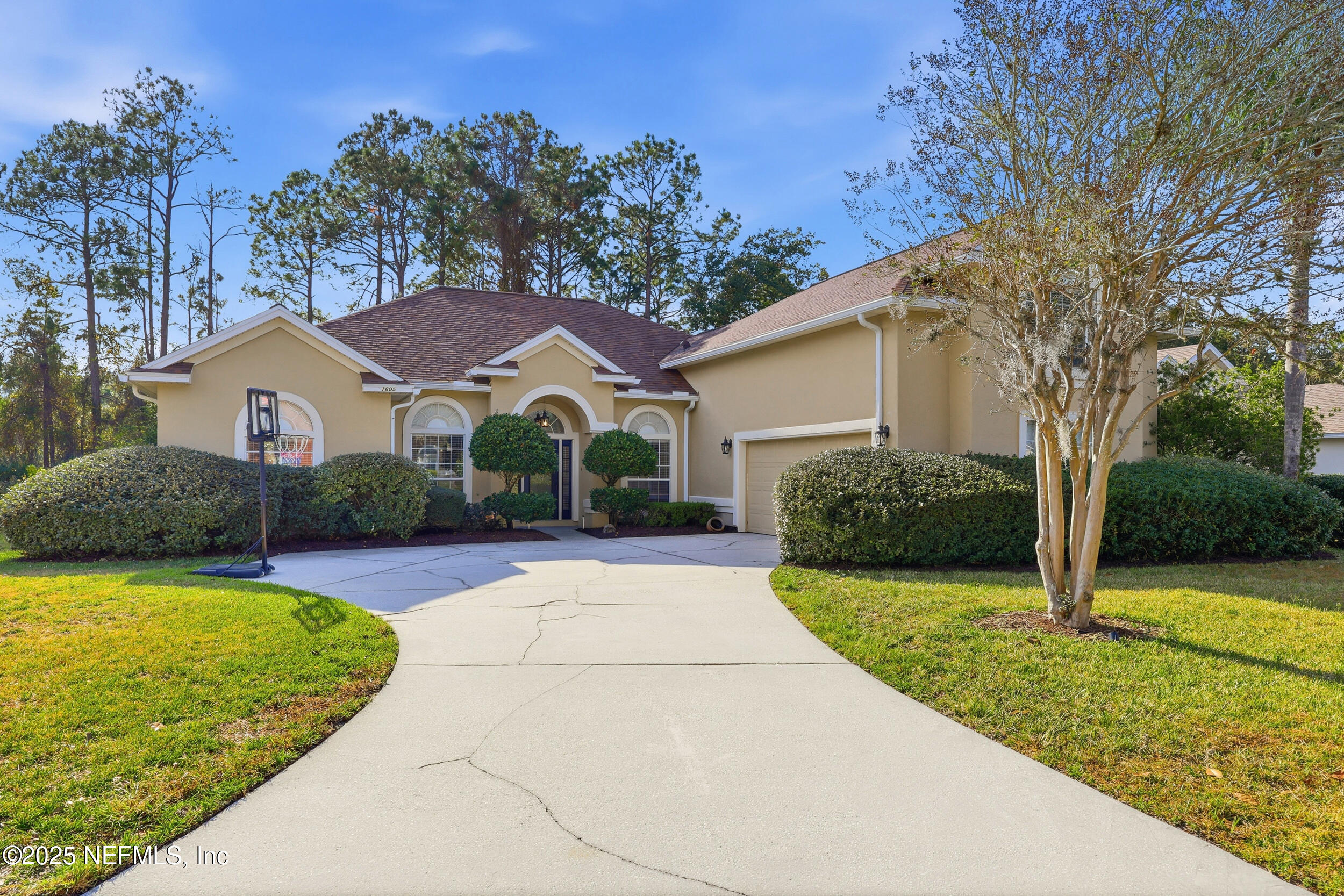 1605 Merroway Lane Ponte Vedra, FL 32081 - Photo 2 of 41 a front view of a house with a yard and garage