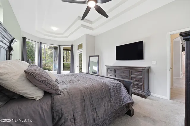 a spacious bathroom with a double vanity sink mirror and bathtub