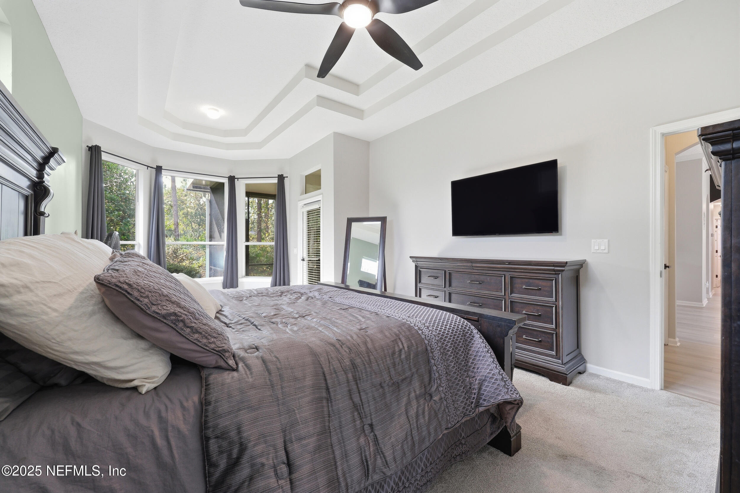 1605 Merroway Lane Ponte Vedra, FL 32081 - Photo 21 of 41 a bedroom with a bed and a flat screen tv