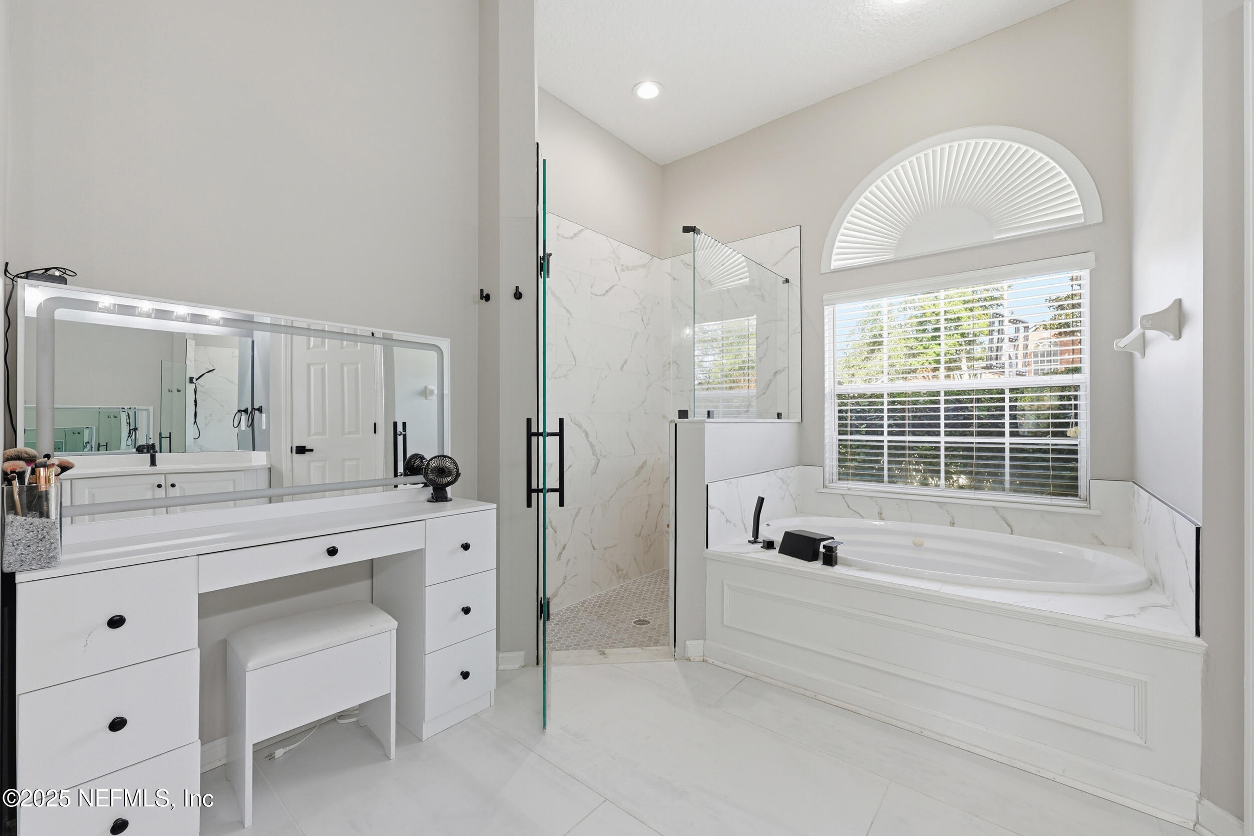 1605 Merroway Lane Ponte Vedra, FL 32081 - Photo 23 of 41 a spacious bathroom with a tub sink and mirror