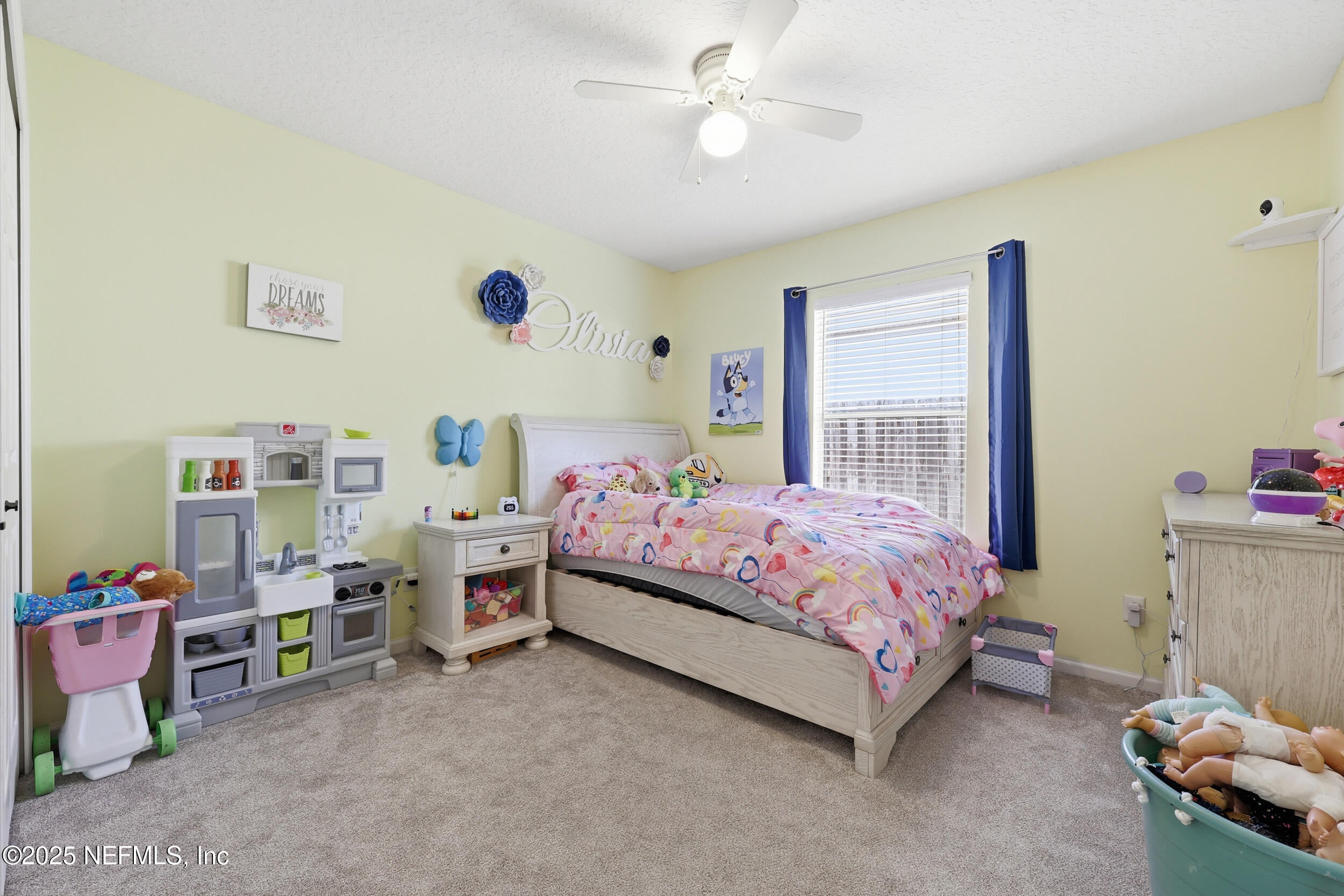 1605 Merroway Lane Ponte Vedra, FL 32081 - Photo 24 of 41 a bedroom with a bed and a chandelier