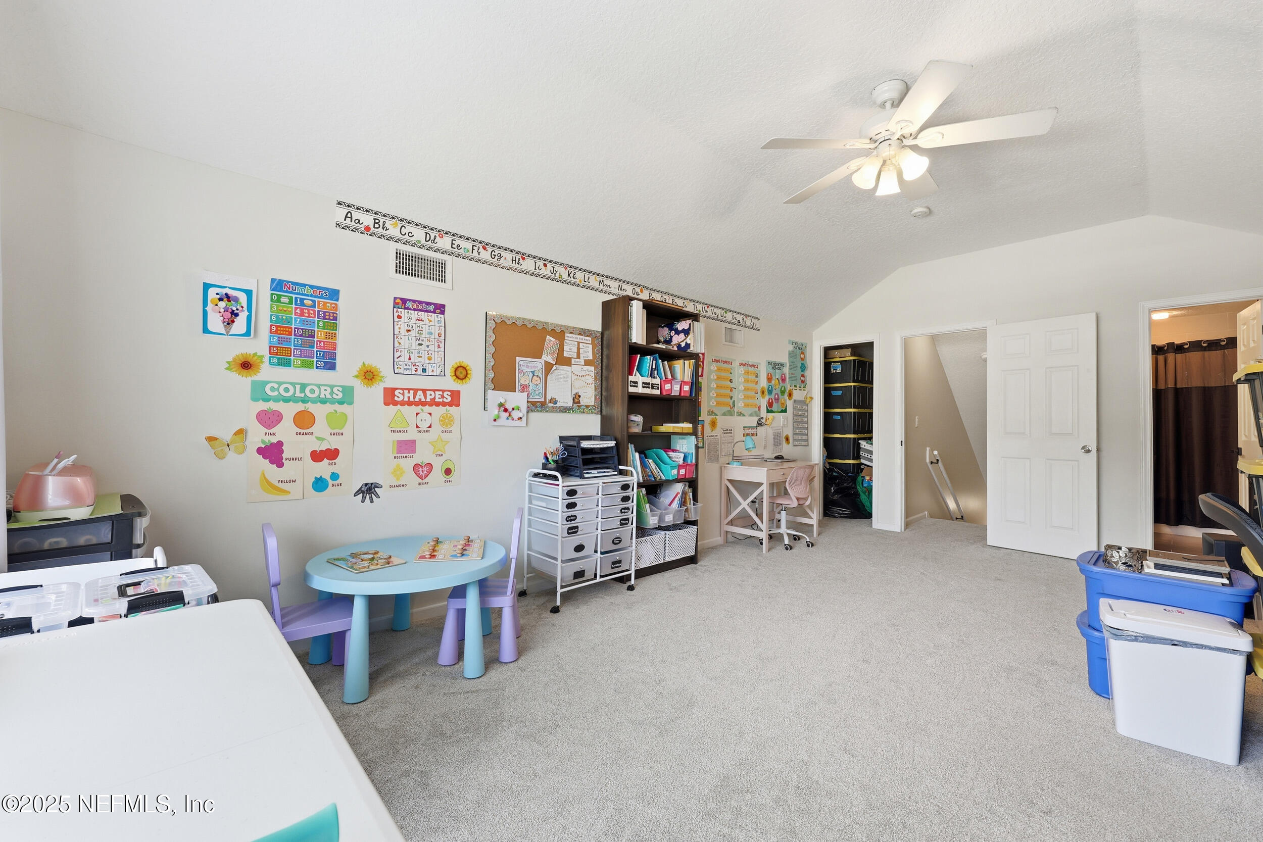 1605 Merroway Lane Ponte Vedra, FL 32081 - Photo 31 of 41 a room with furniture a chandelier and a flat screen tv