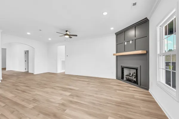 a view of an empty room with a fireplace