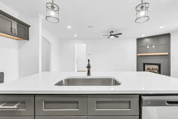 a kitchen with a sink and a refrigerator