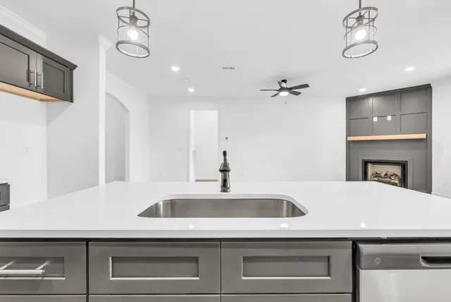 a kitchen with a sink and a refrigerator