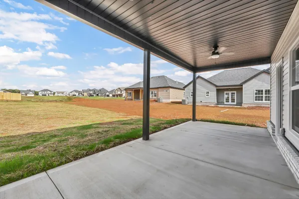 a house that has a big yard in front of it