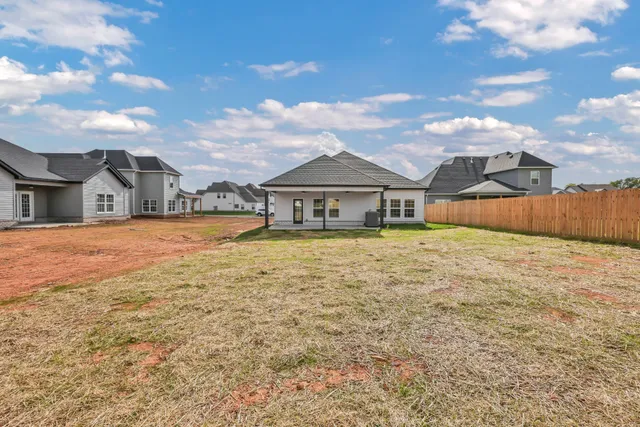 a house view with wooden fence