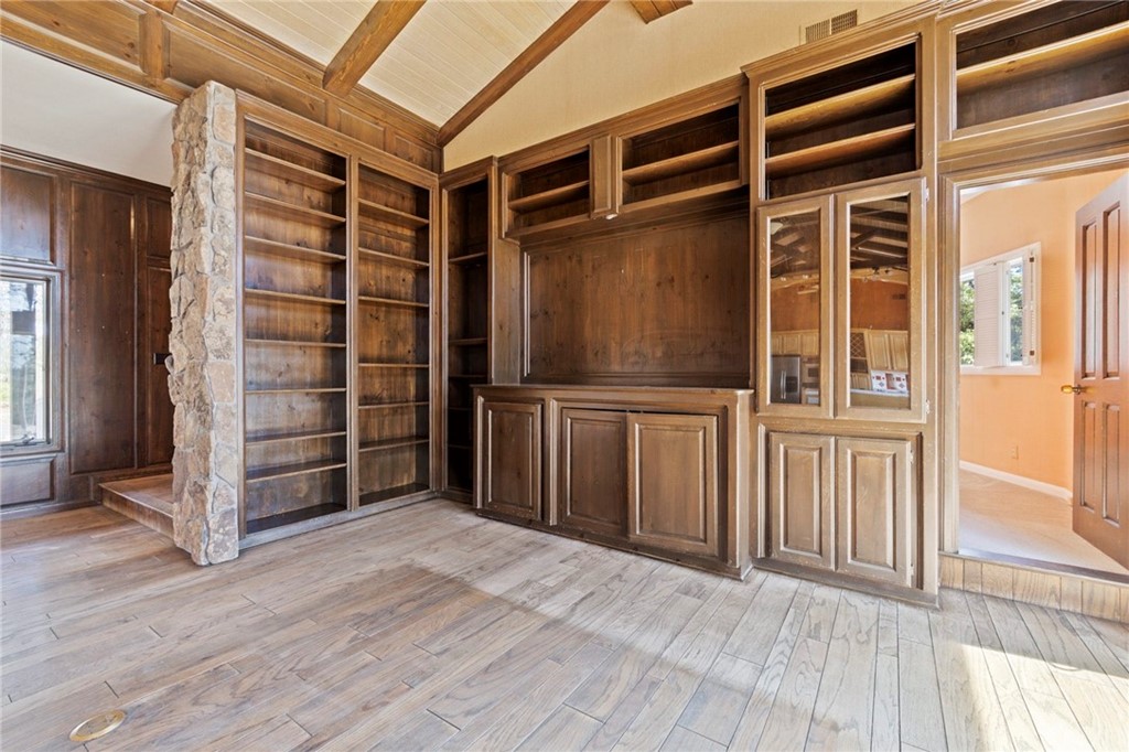 10379 McMahon Road Coulterville, CA 95311 - Photo 21 of 63 a view of empty room with wooden floor and windows