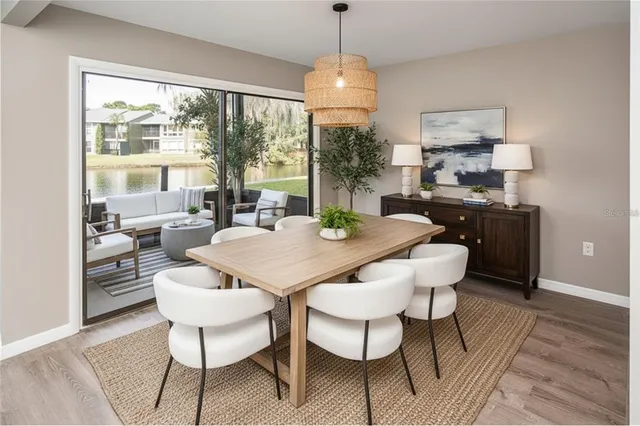 a view of a dining room with furniture window and outside view