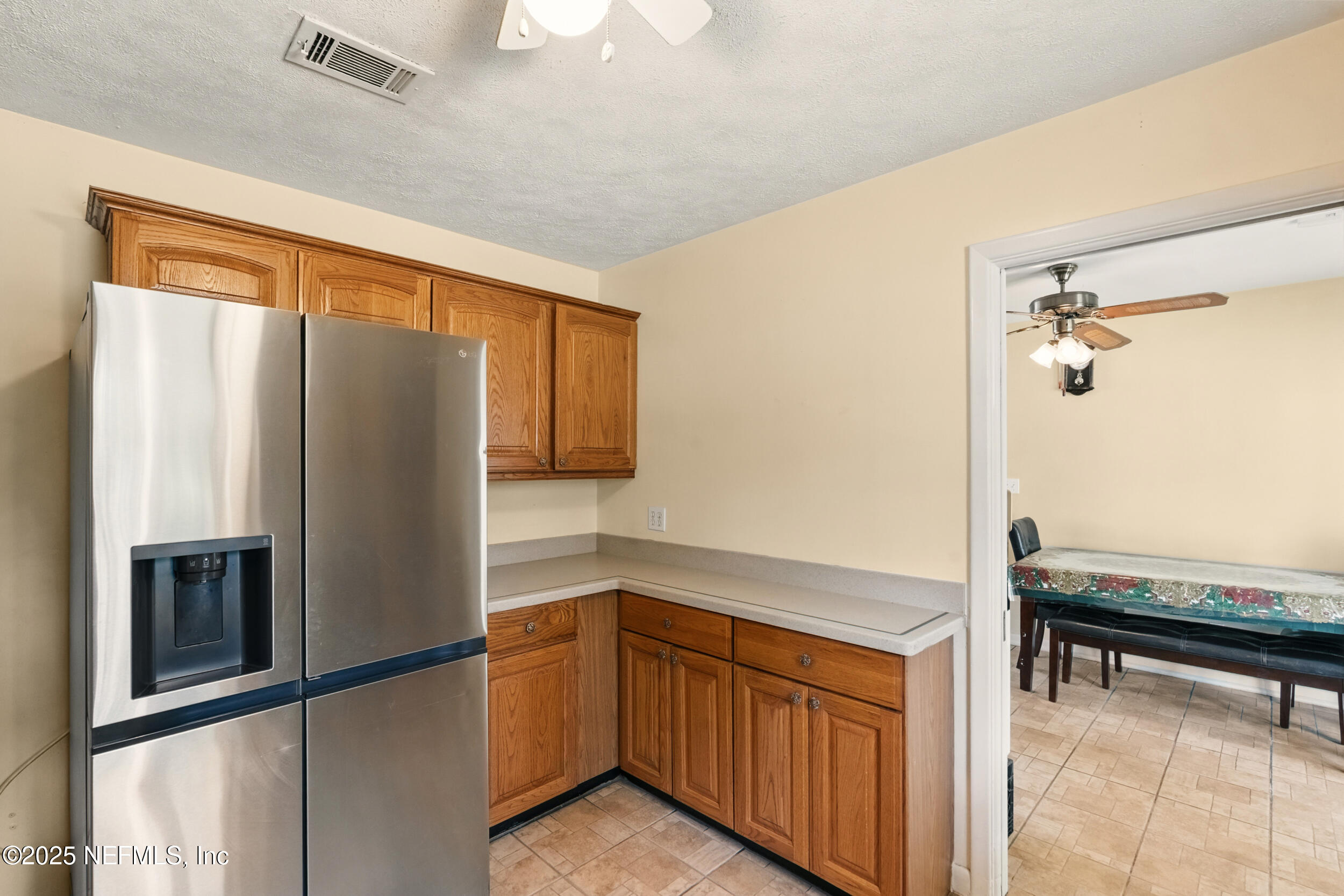 2826 Sam Road Jacksonville, FL 32216 - Photo 12 of 34 a kitchen with stainless steel appliances granite countertop a refrigerator and a sink