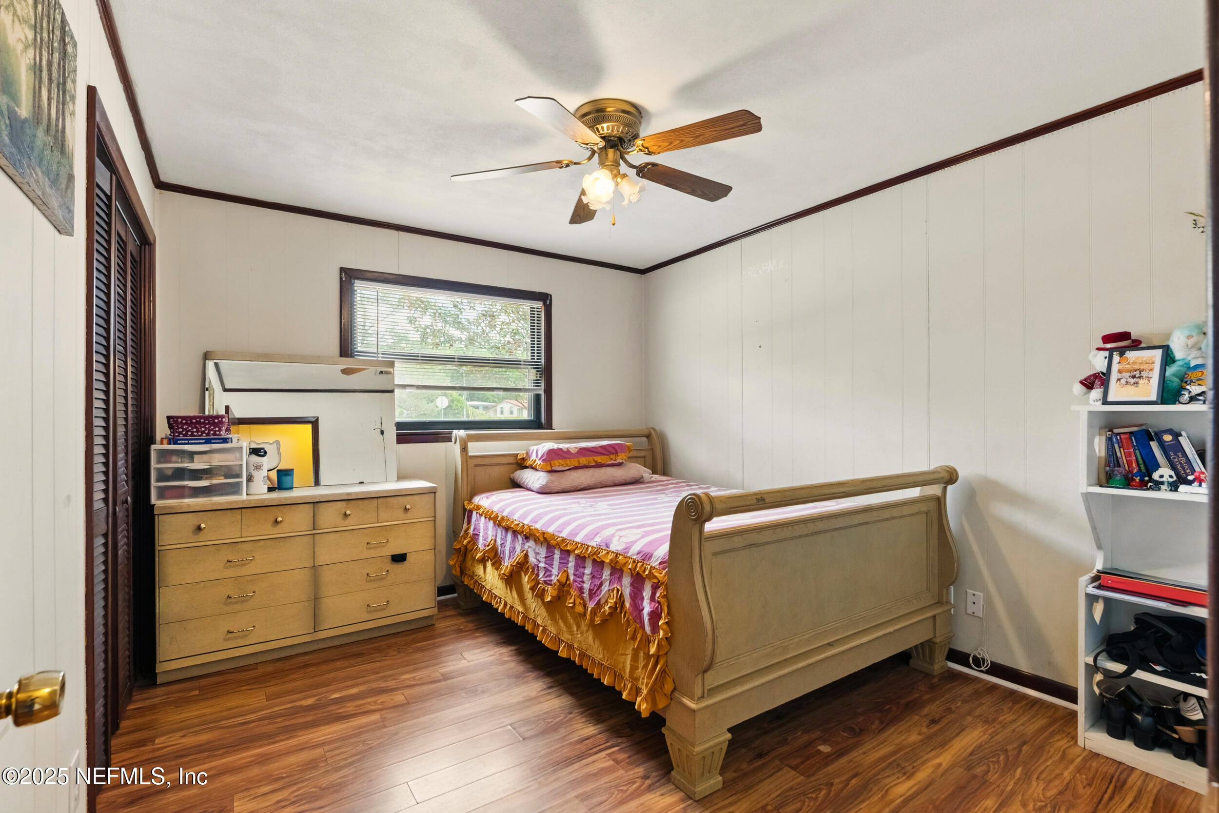2826 Sam Road Jacksonville, FL 32216 - Photo 16 of 34 a bed room with a bed and a window