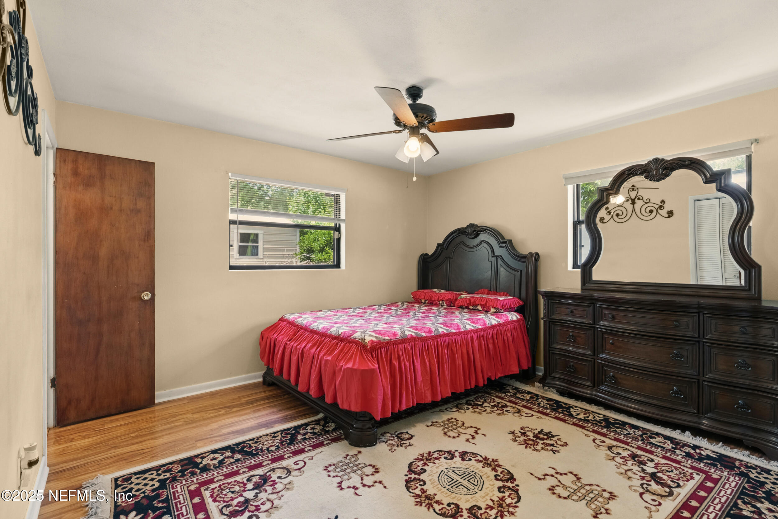 2826 Sam Road Jacksonville, FL 32216 - Photo 18 of 34 a bedroom with a bed and a dresser