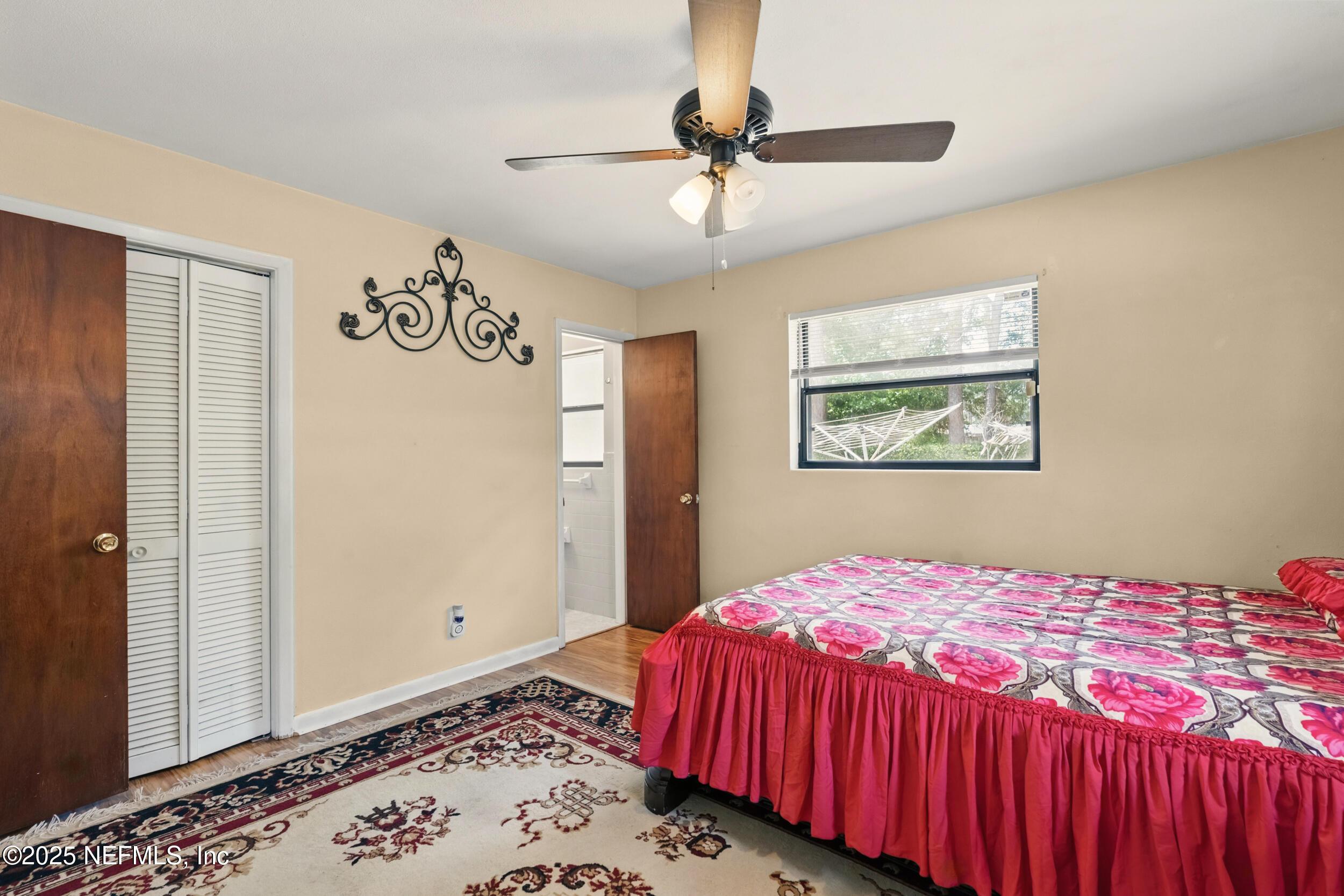 2826 Sam Road Jacksonville, FL 32216 - Photo 19 of 34 a bedroom with a bed and a dresser