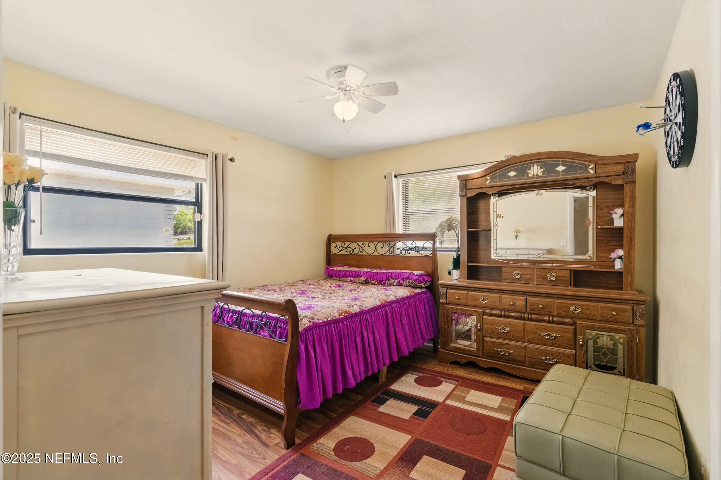 2826 Sam Road Jacksonville, FL 32216 - Photo 22 of 34 a bedroom with a bed and a dresser