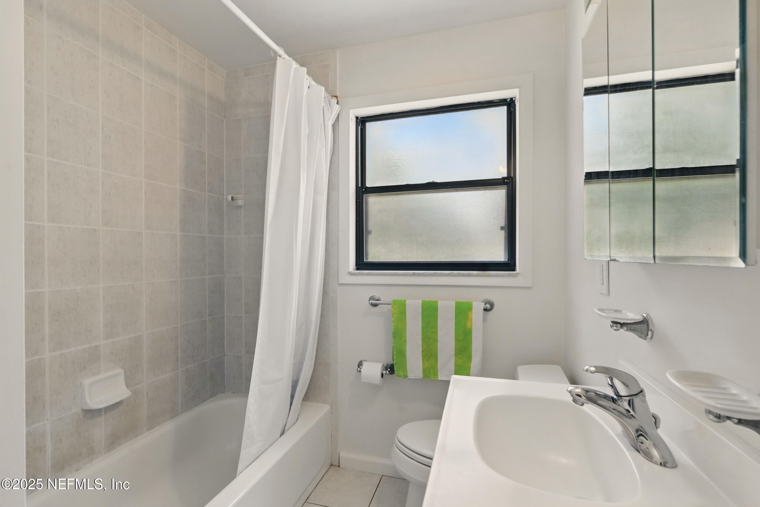 2826 Sam Road Jacksonville, FL 32216 - Photo 26 of 34 a bathroom with a sink toilet and tub