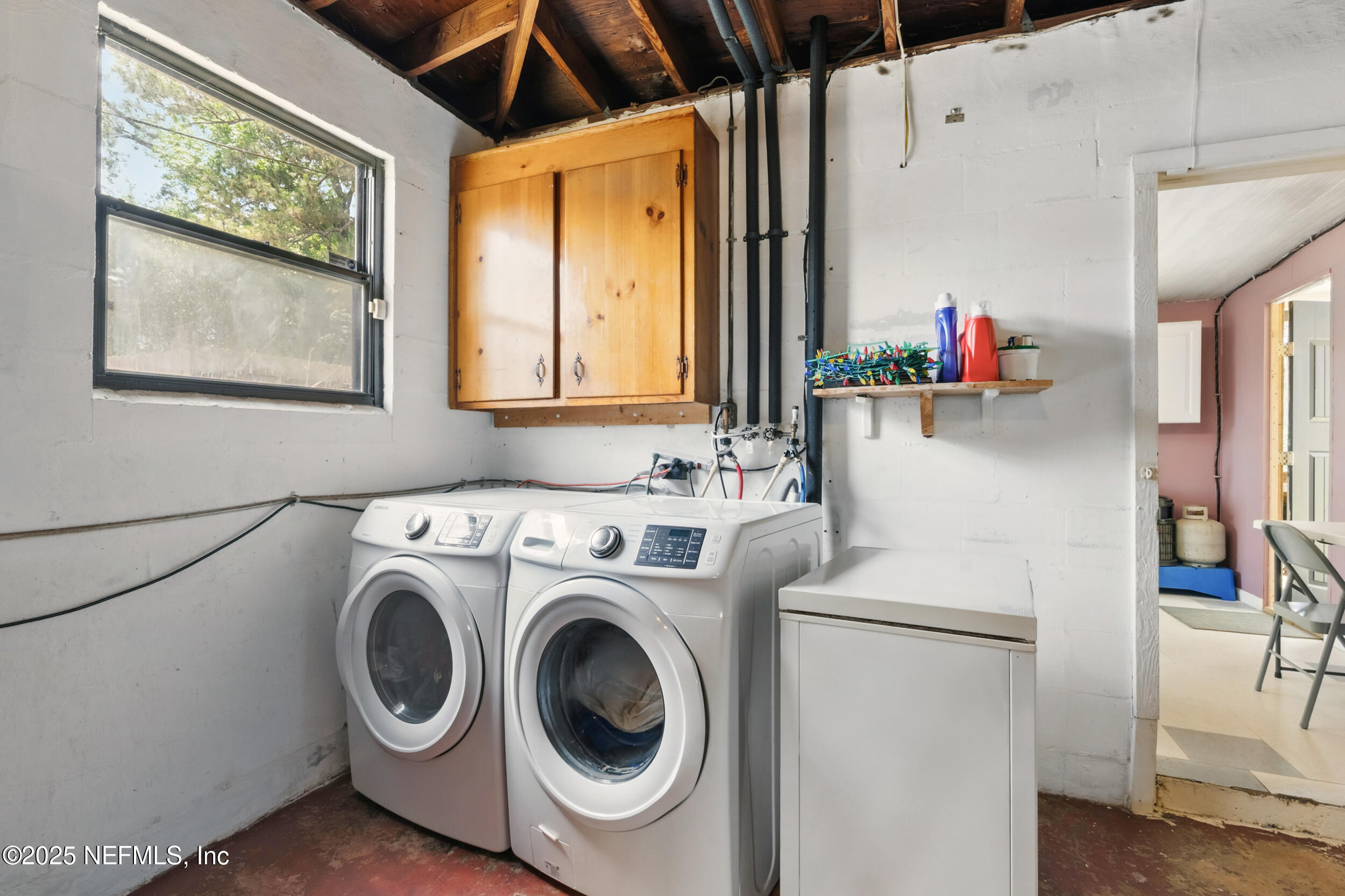 2826 Sam Road Jacksonville, FL 32216 - Photo 27 of 34 a utility room with dryer and washer