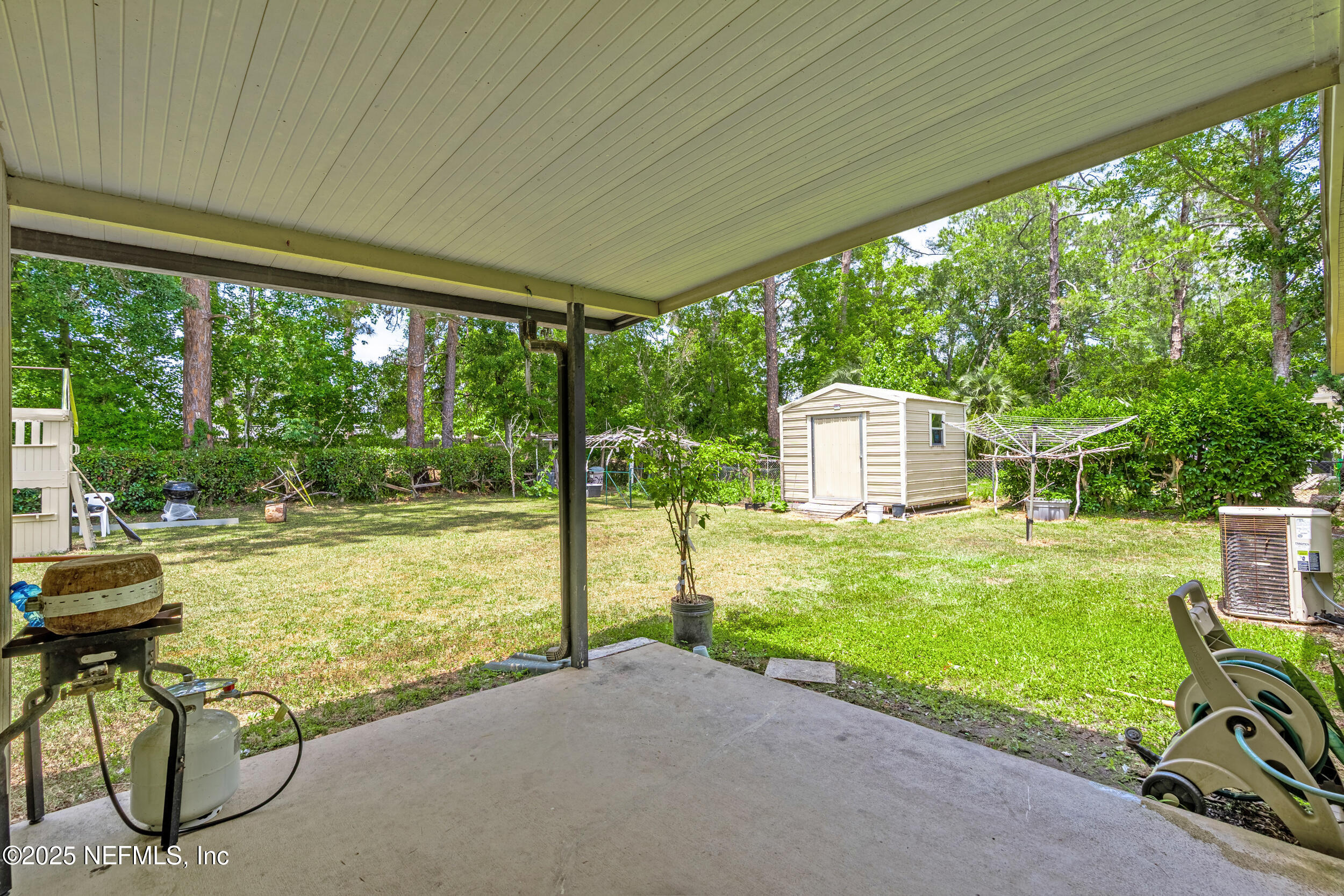 2826 Sam Road Jacksonville, FL 32216 - Photo 29 of 34 a view of backyard with swimming pool and outdoor seating