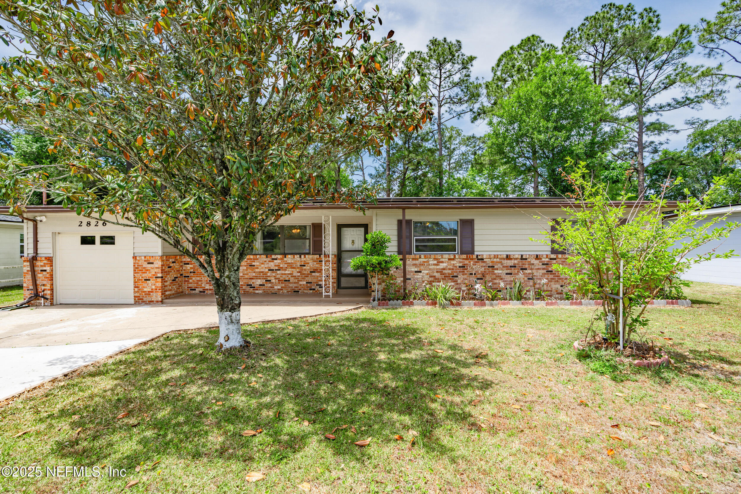 2826 Sam Road Jacksonville, FL 32216 - Photo 3 of 34 front view of a house with a yard