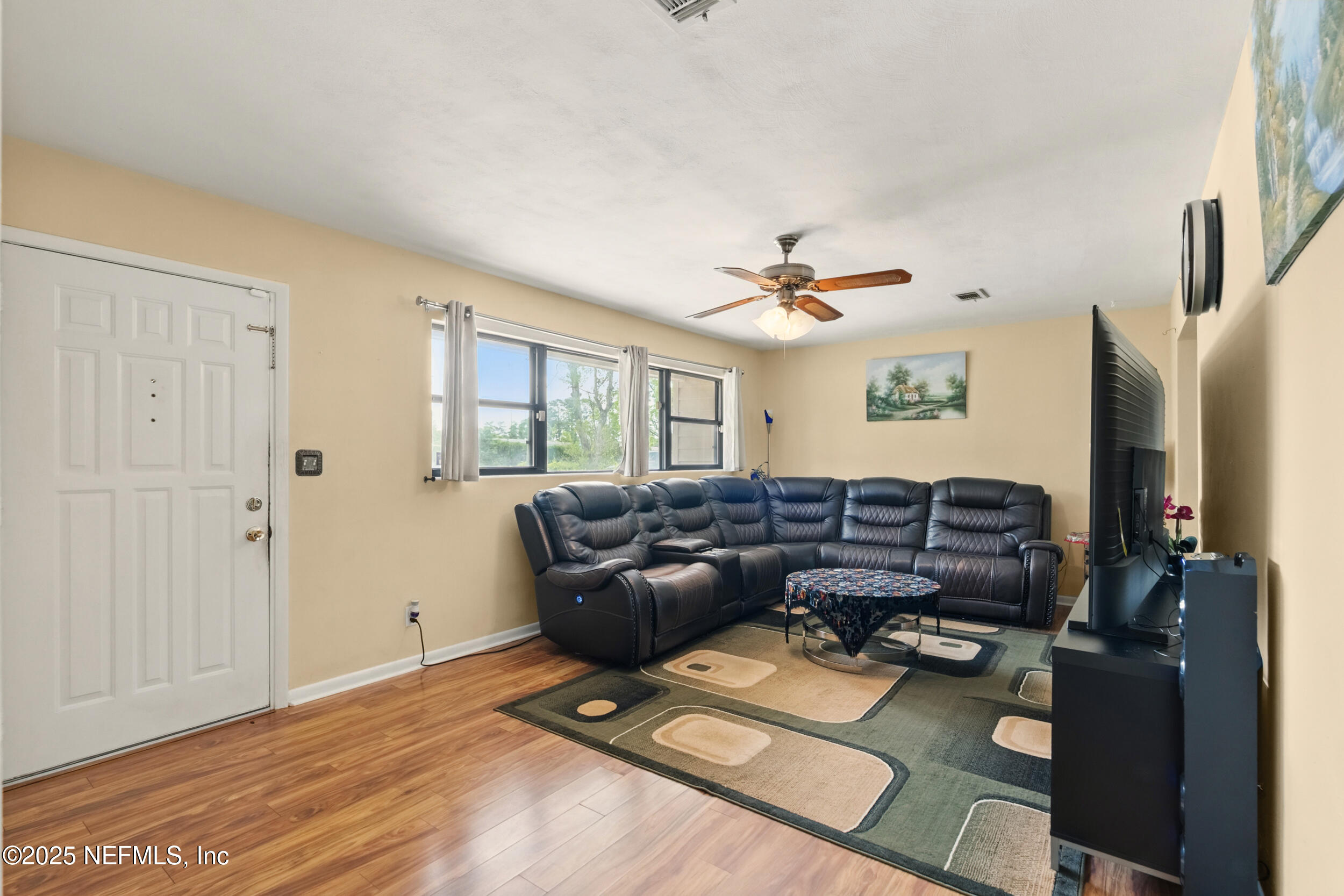2826 Sam Road Jacksonville, FL 32216 - Photo 6 of 34 a living room with furniture and a window