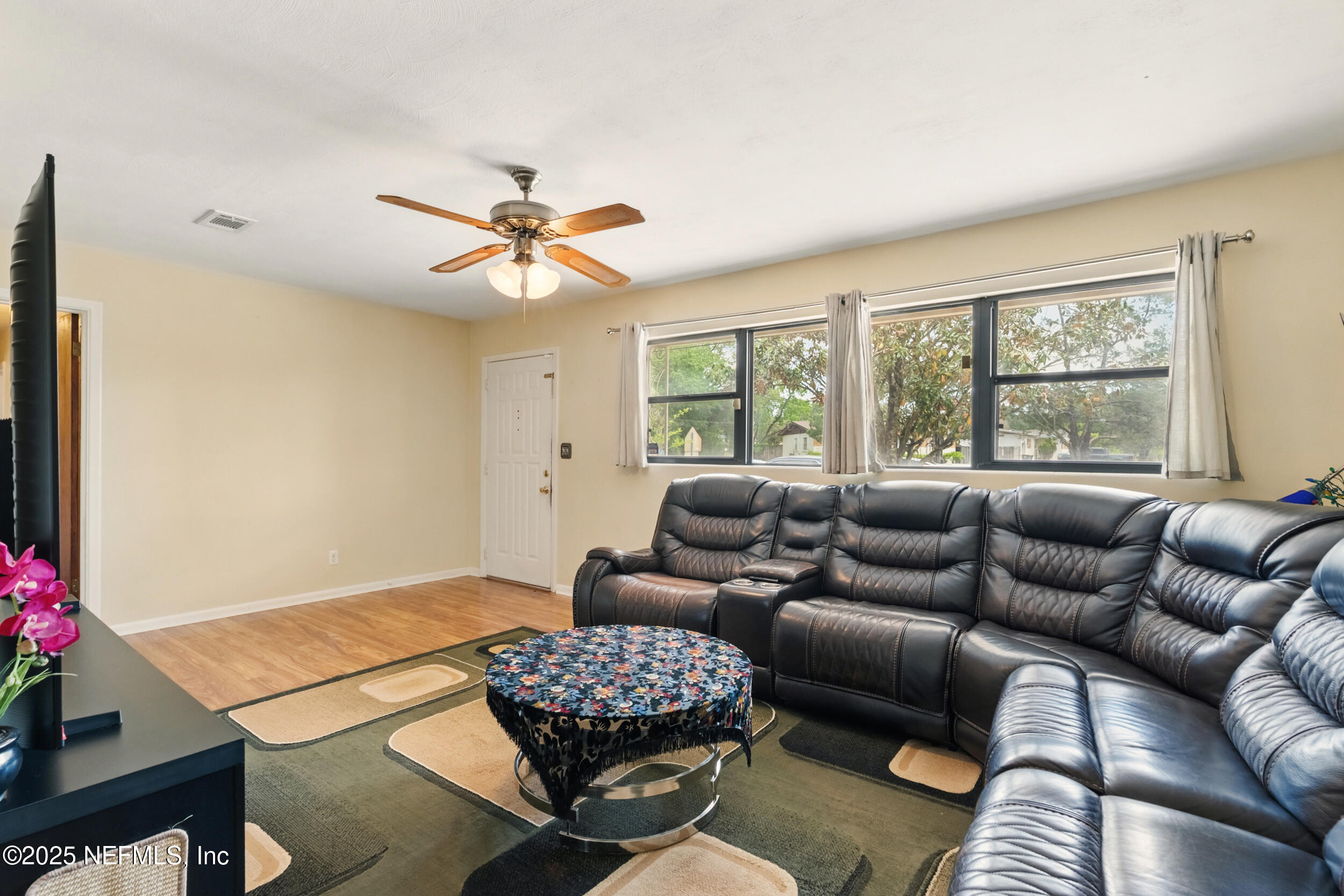 2826 Sam Road Jacksonville, FL 32216 - Photo 7 of 34 a living room with furniture and a large window
