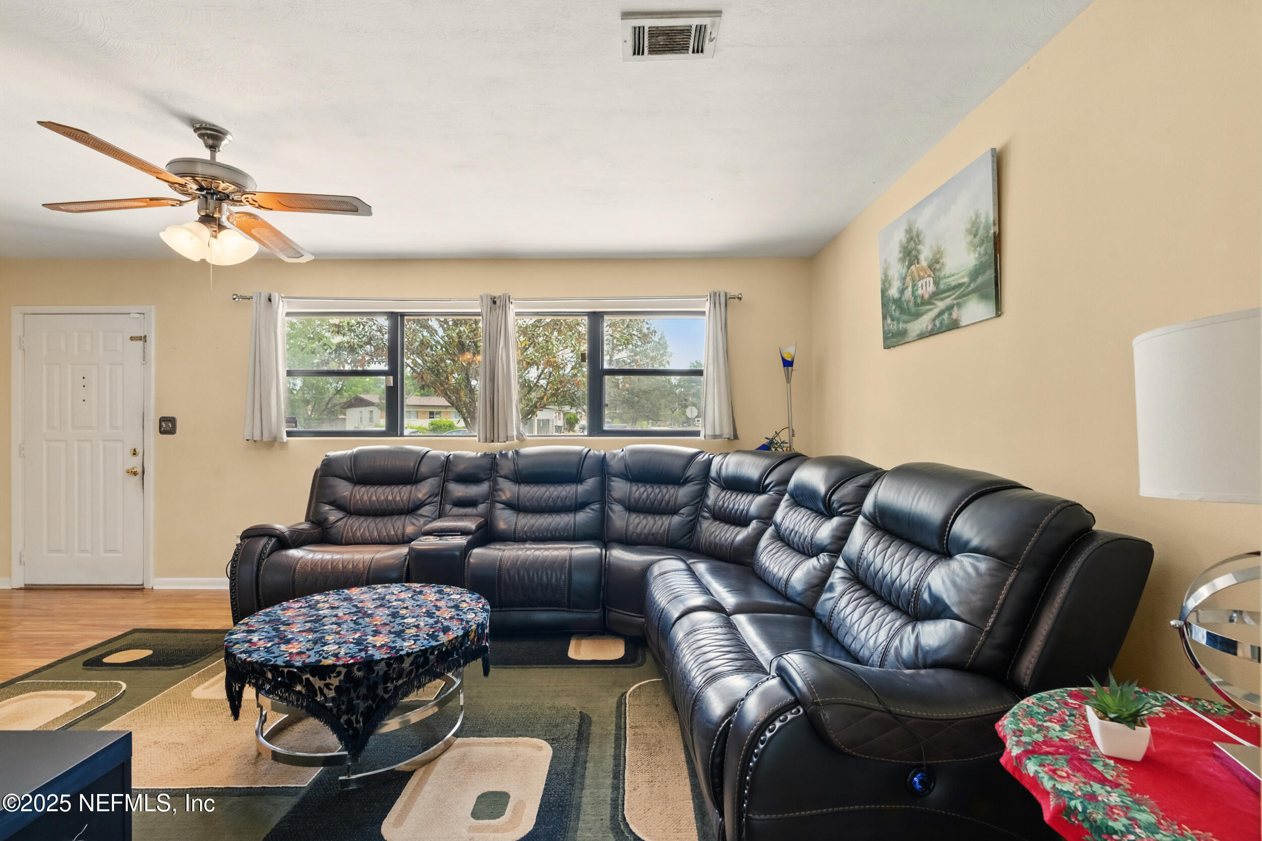 2826 Sam Road Jacksonville, FL 32216 - Photo 8 of 34 a living room with furniture and a large window