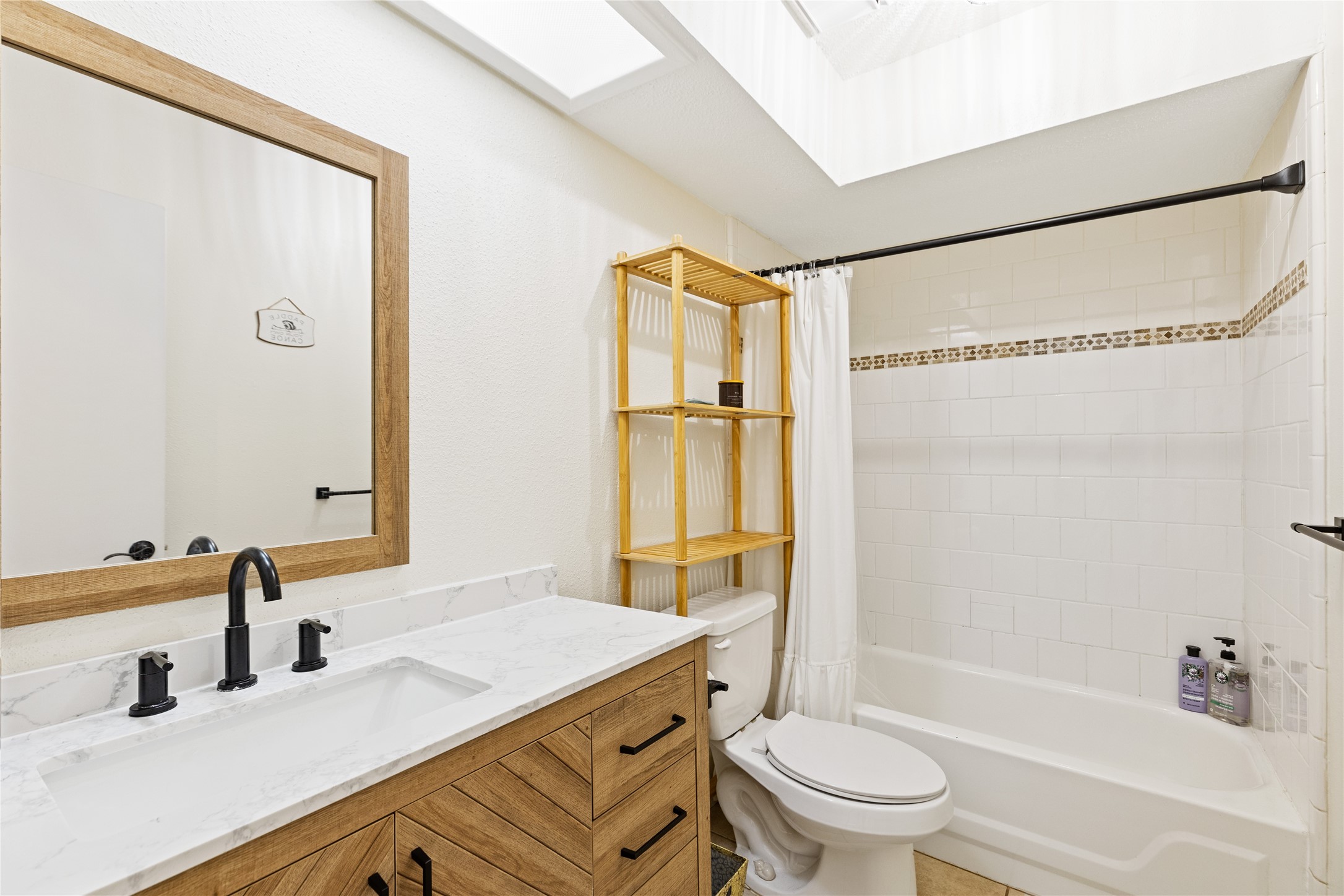 9719 Orangevale Drive Spring, TX 77379 - Photo 19 of 32 Secondary updated bathroom with large tub, attractive quartz counter and vanity.