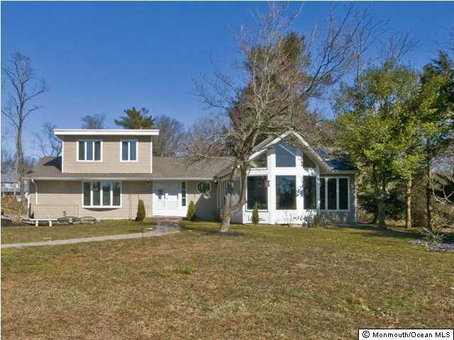 1448 Ocean Road Wall, NJ 07719 - Photo 1 of 3 a front view of a house with a yard