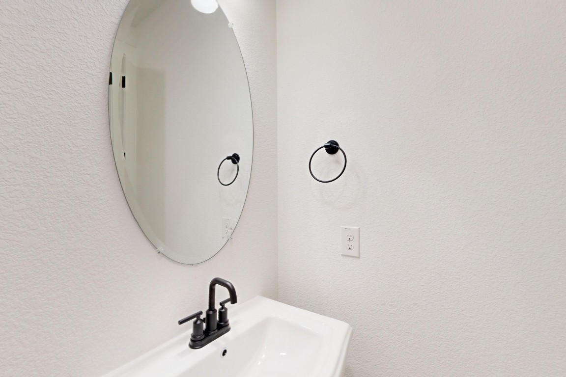 2020 Billings Way Leander, TX 78641 - Photo 21 of 35 a bathroom with a sink and a mirror