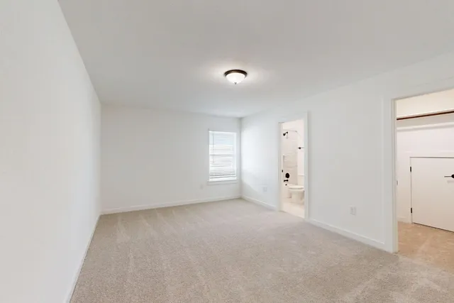 a bathroom with a toilet and a bathtub