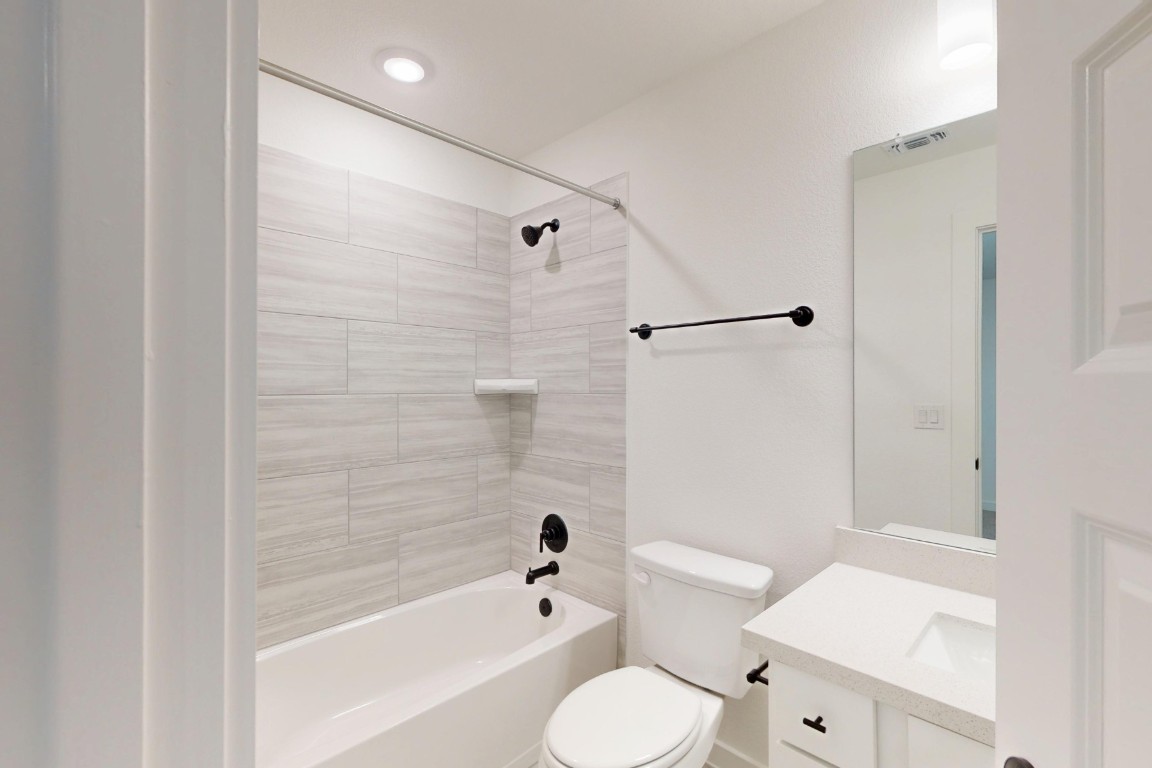 2020 Billings Way Leander, TX 78641 - Photo 25 of 35 a bathroom with a toilet and a bathtub