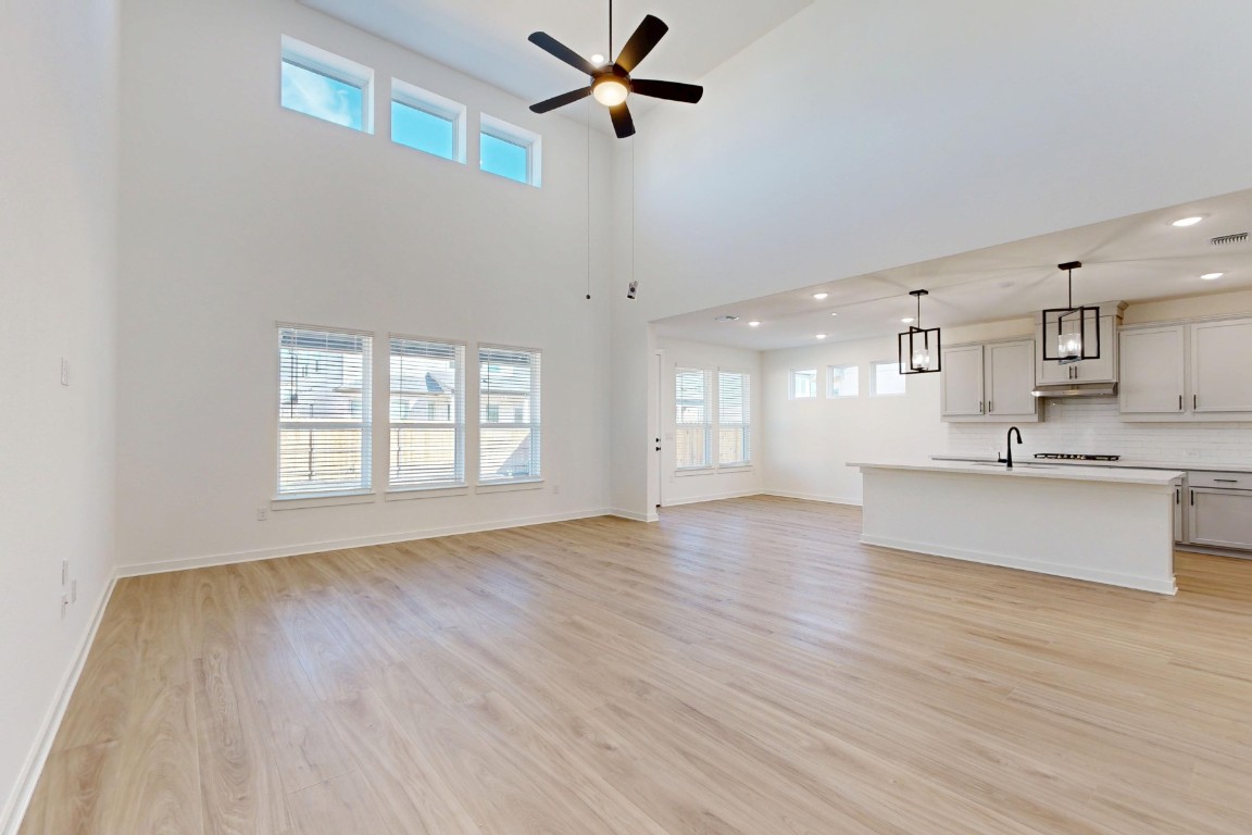 2020 Billings Way Leander, TX 78641 - Photo 4 of 35 a view of an empty room with window and wooden floor