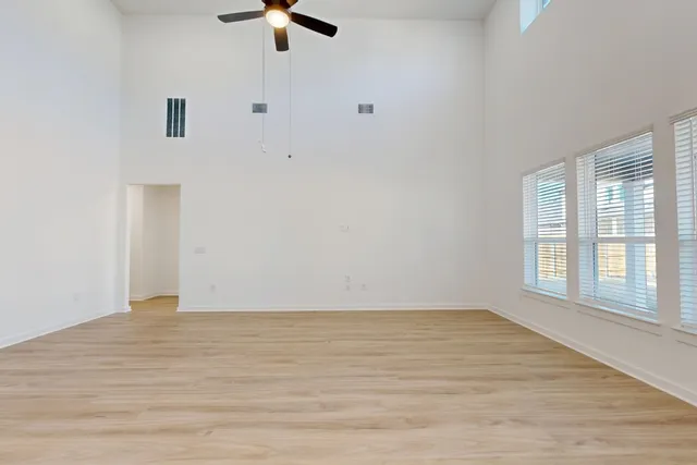 a view of an empty room with a window