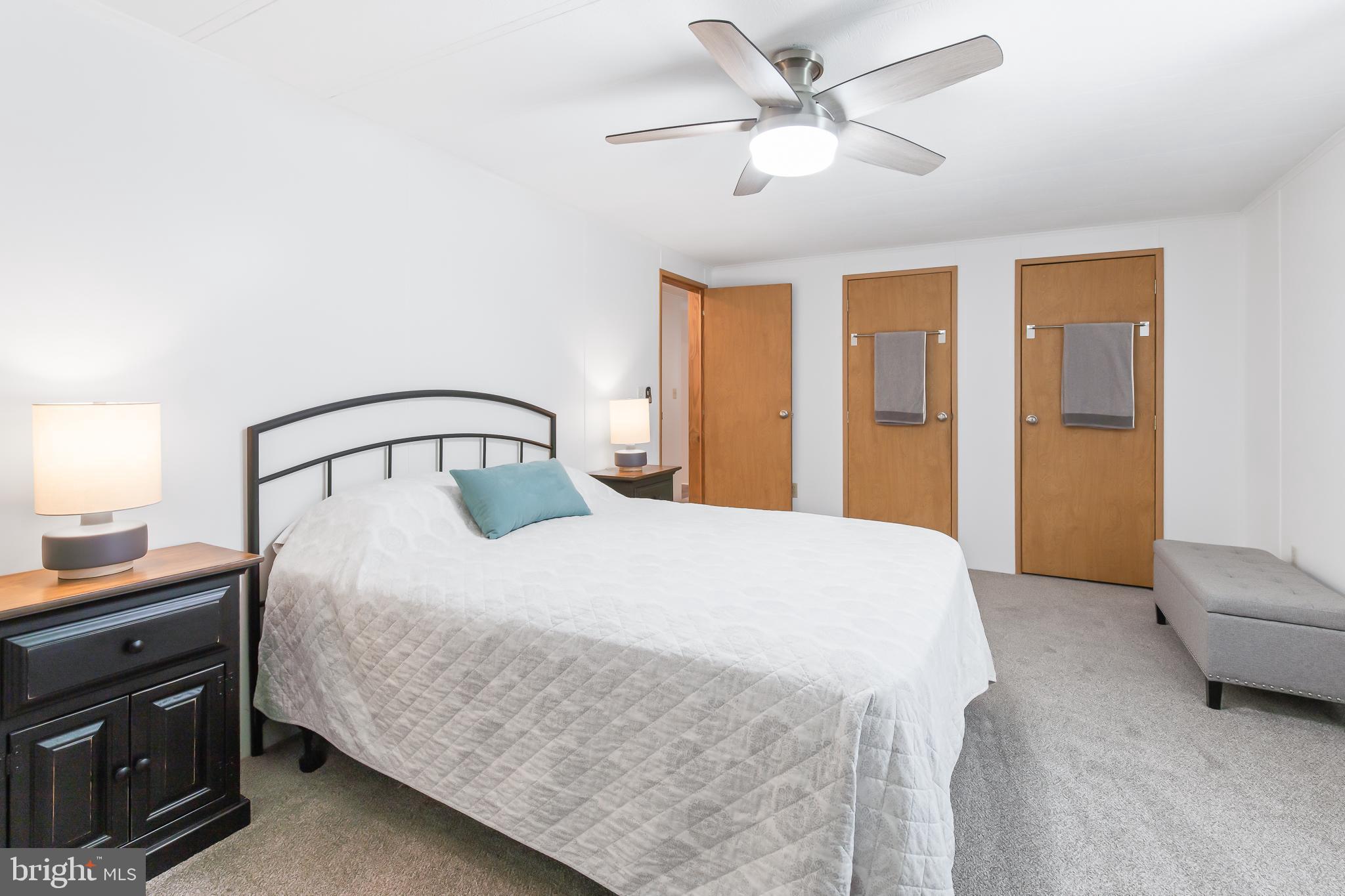 411 Maple Avenue Manheim, PA 17545 - Photo 20 of 35 a bedroom with a bed and a chandelier