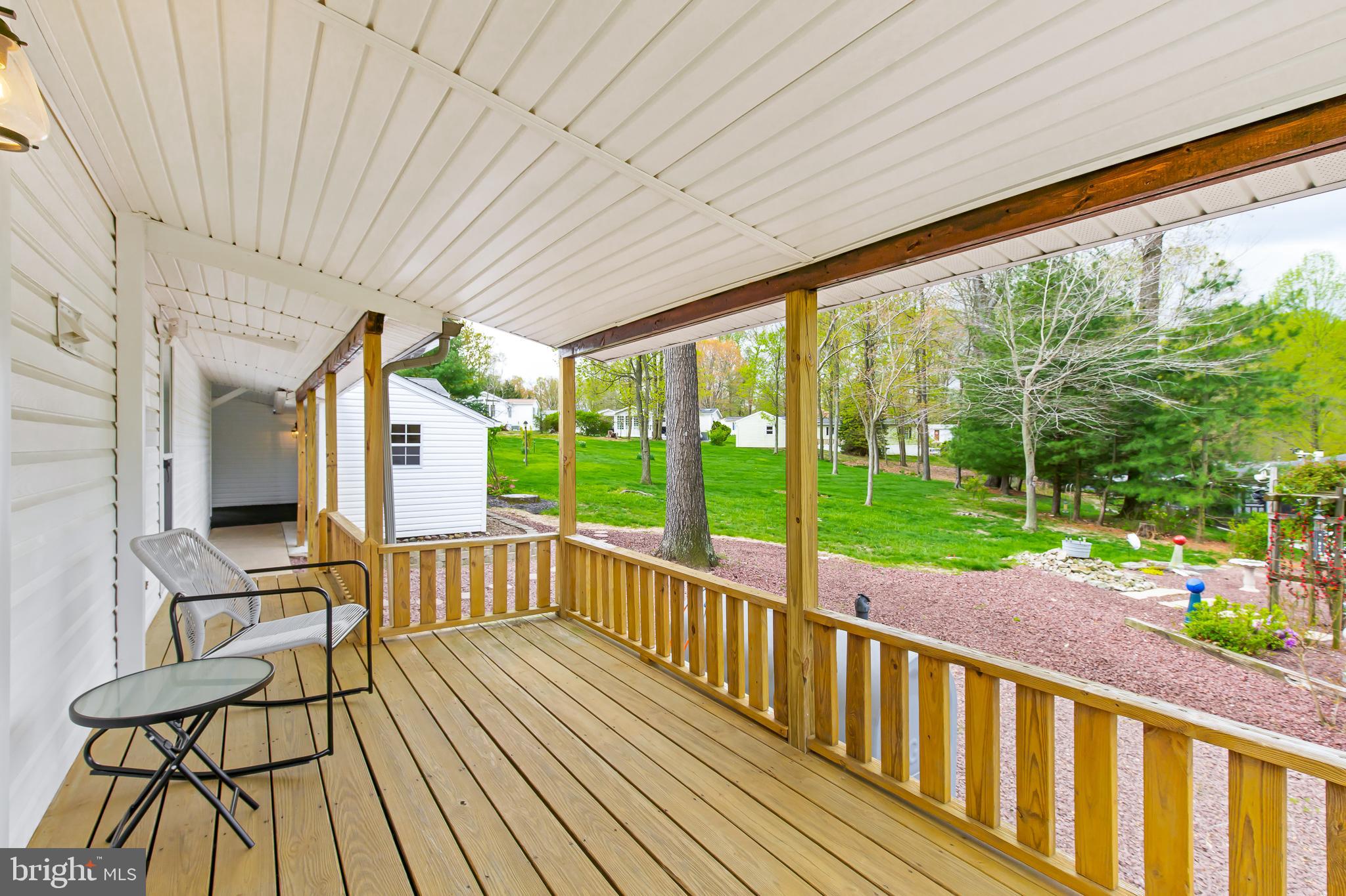 411 Maple Avenue Manheim, PA 17545 - Photo 26 of 35 a view of a patio with wooden floor table and chairs