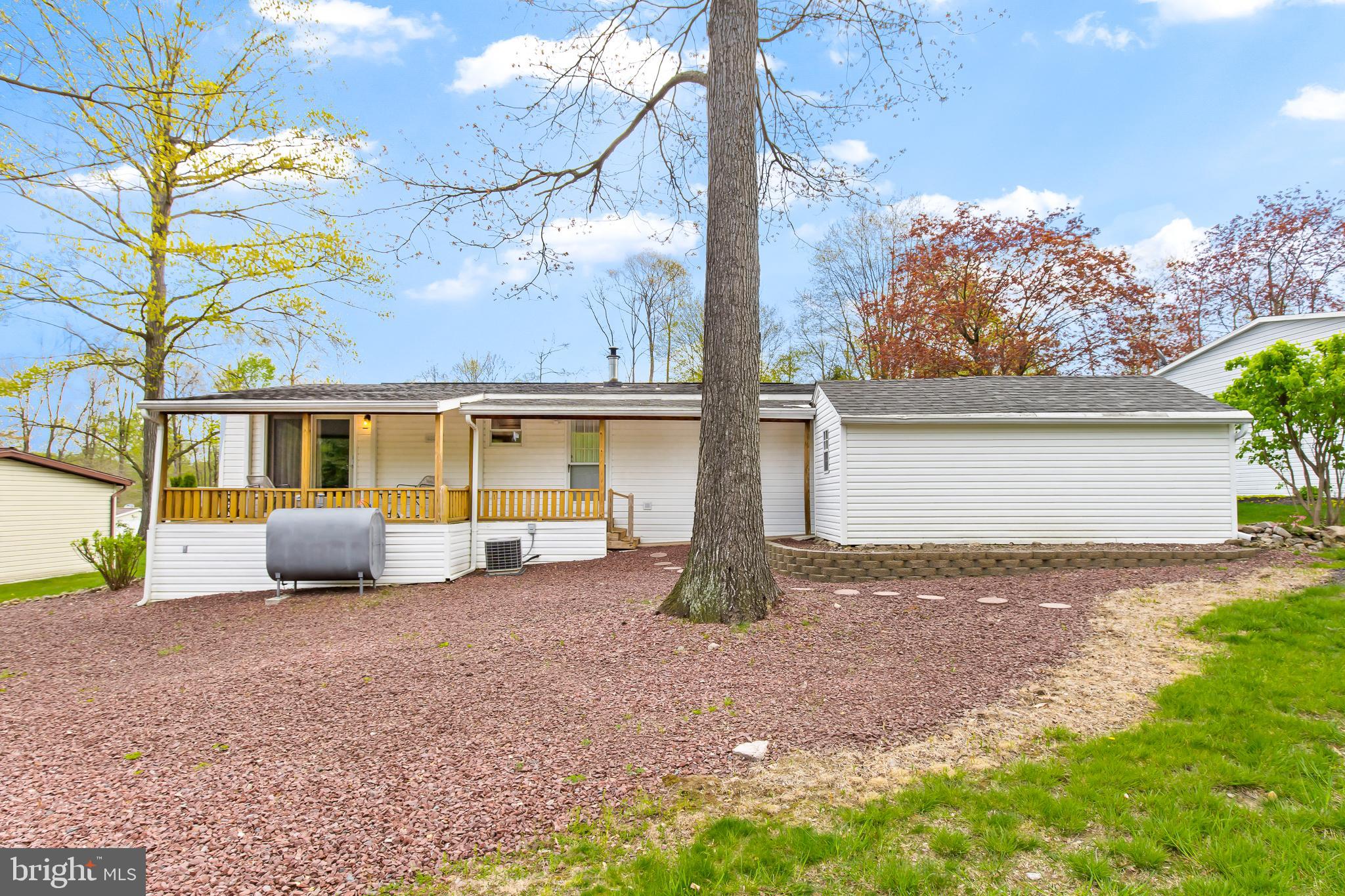411 Maple Avenue Manheim, PA 17545 - Photo 29 of 35 a view of a house with backyard and a tree