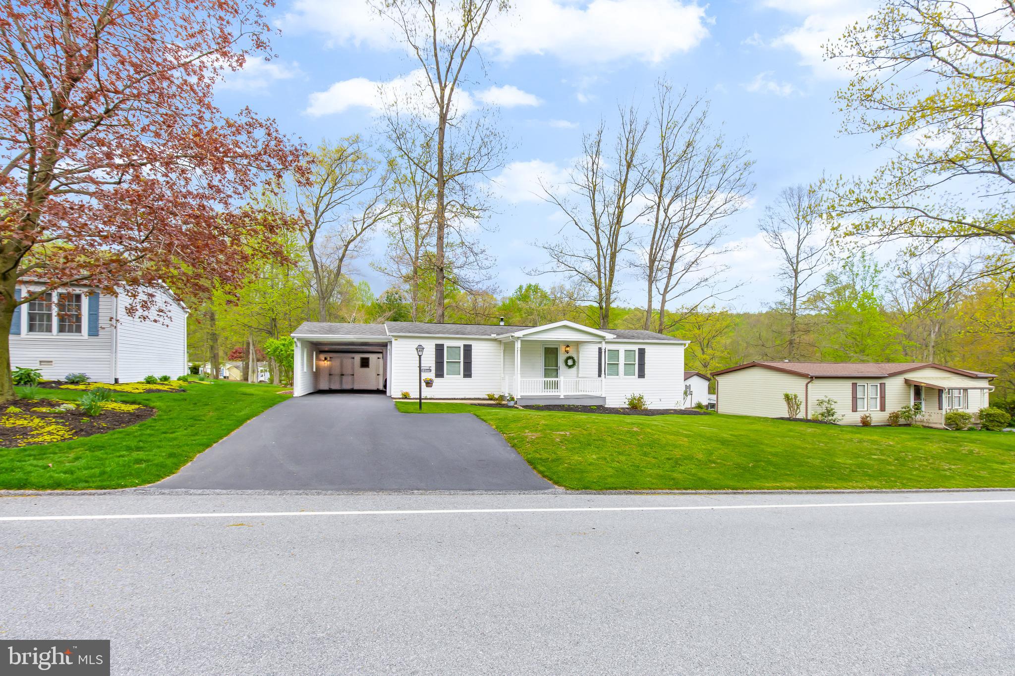 411 Maple Avenue Manheim, PA 17545 - Photo 35 of 35 a front view of a house with a yard and garage