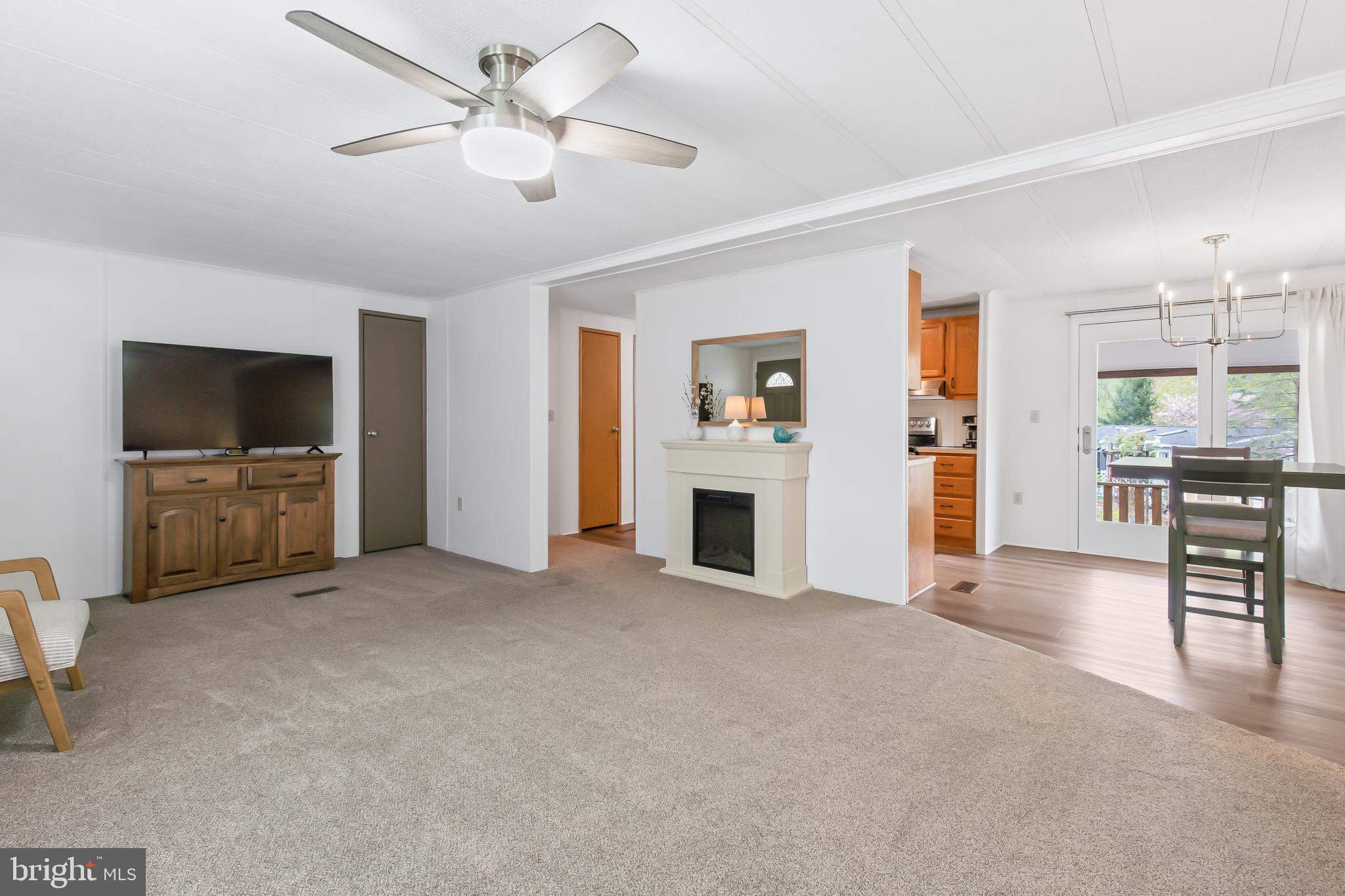411 Maple Avenue Manheim, PA 17545 - Photo 5 of 35 a view of livingroom with furniture flat screen tv and kitchen view