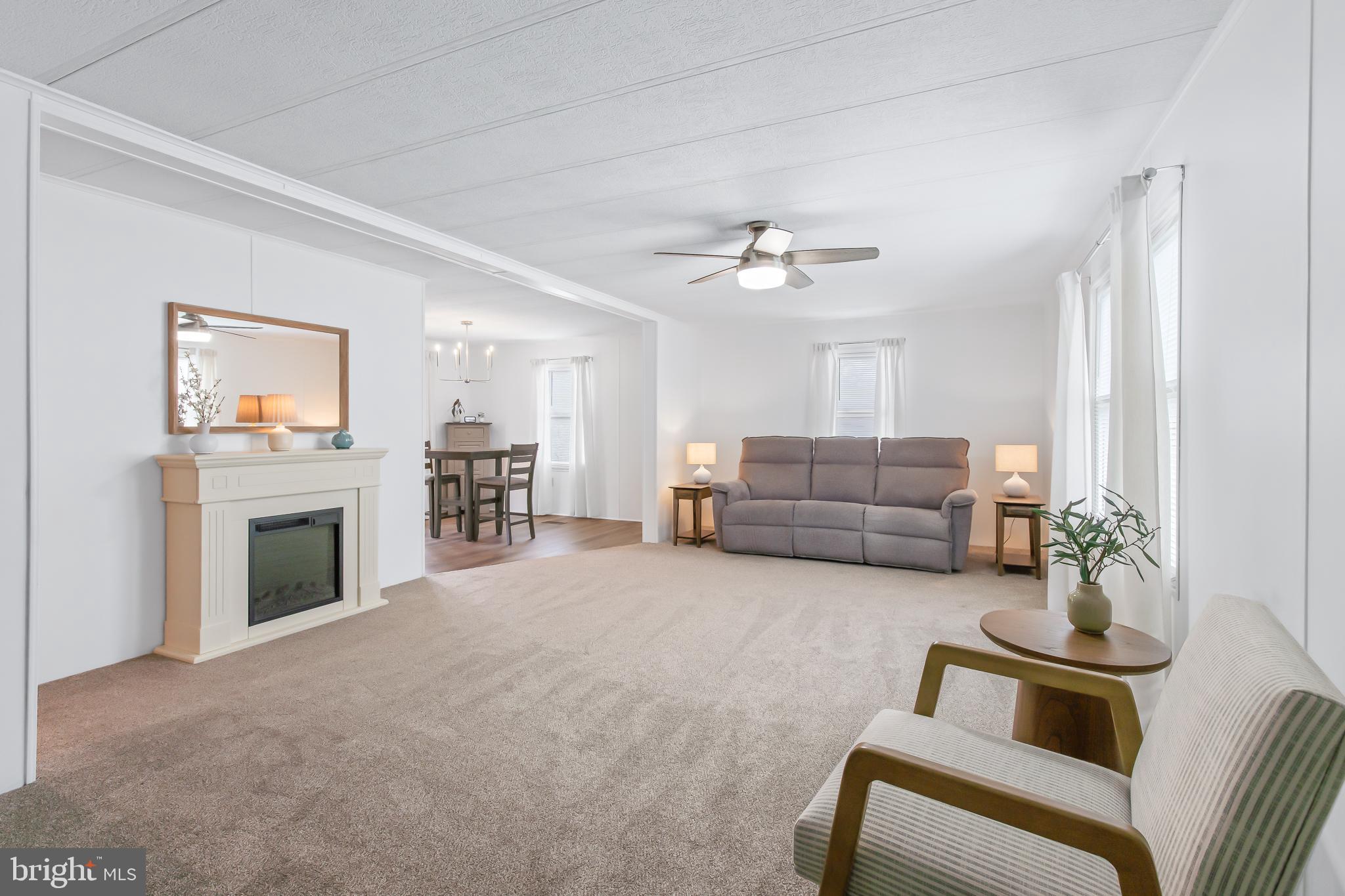 411 Maple Avenue Manheim, PA 17545 - Photo 8 of 35 a living room with furniture and a fireplace