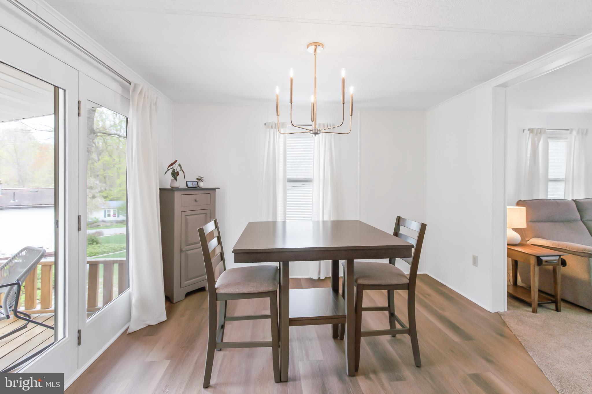 411 Maple Avenue Manheim, PA 17545 - Photo 10 of 35 a view of a dining room with furniture window and wooden floor