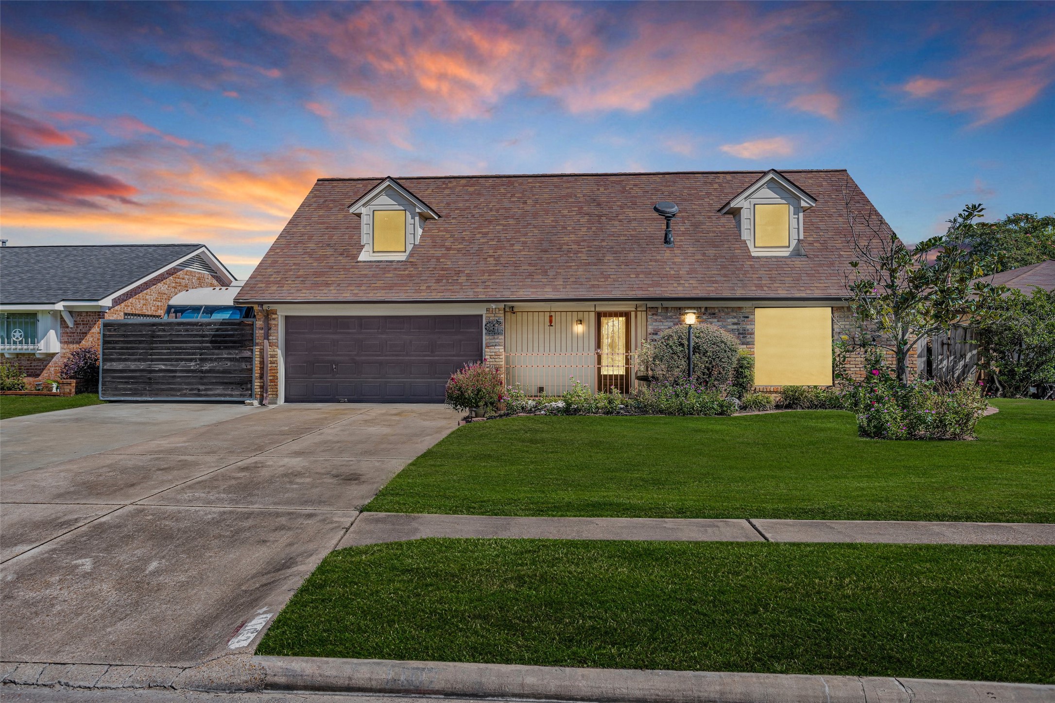 1102 Mosher Lane Houston, TX 77088 - Photo 1 of 50 a front view of a house with a garden