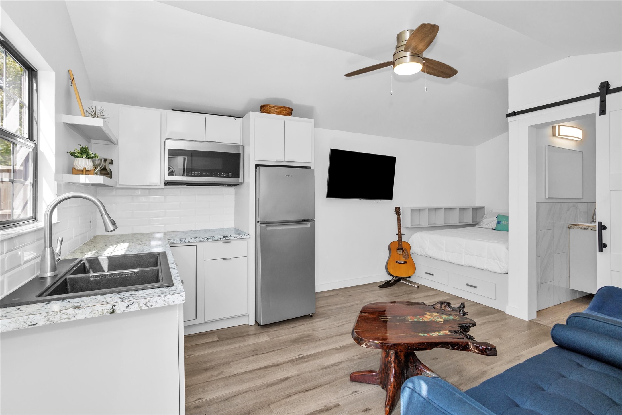 1102 Mosher Lane Houston, TX 77088 - Photo 33 of 50 a kitchen with a refrigerator sink and wooden floor