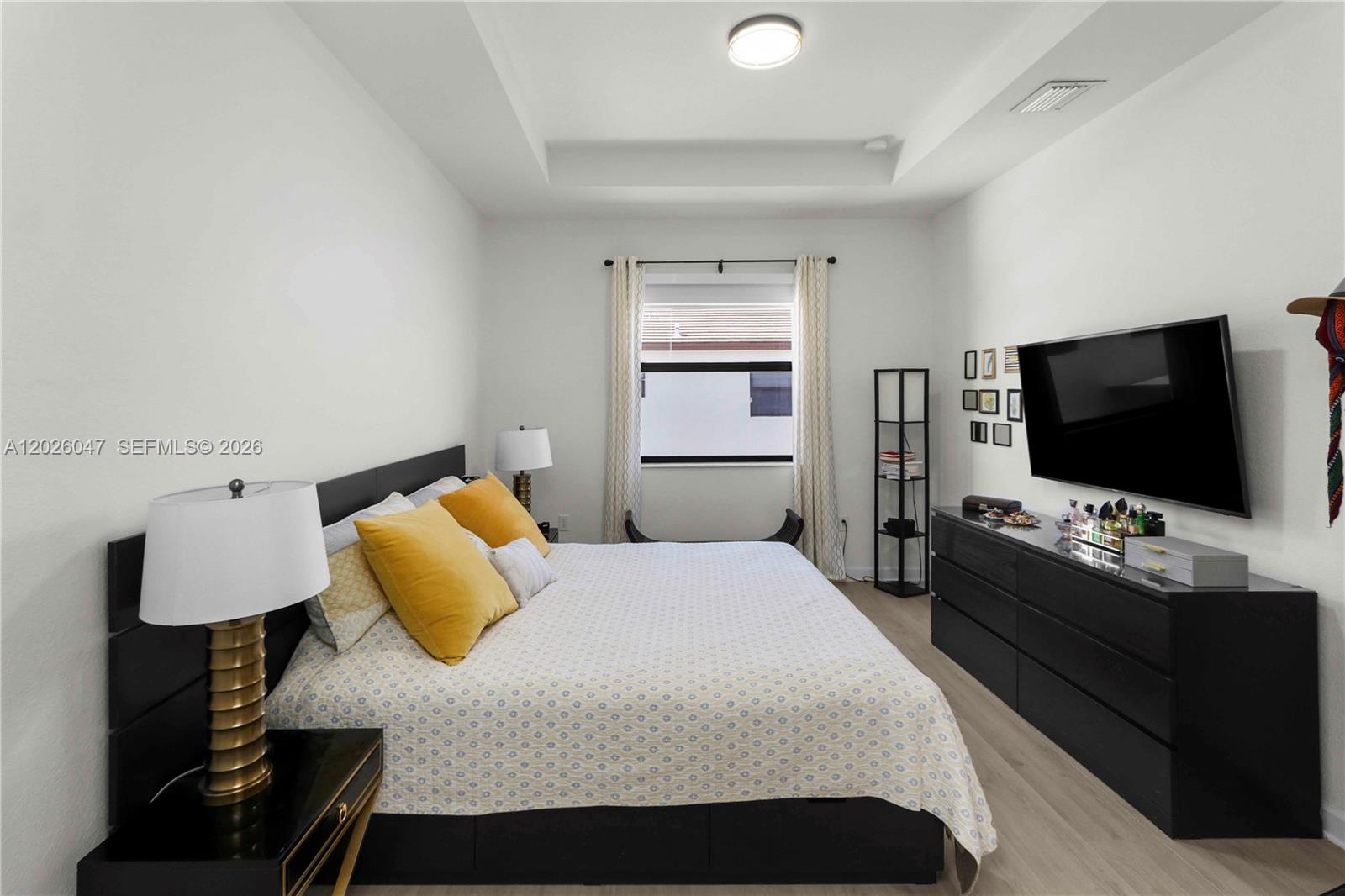 12862 Southwest 231st Street Miami, FL 33170 - Photo 20 of 30 a bedroom with a bed and a flat screen tv