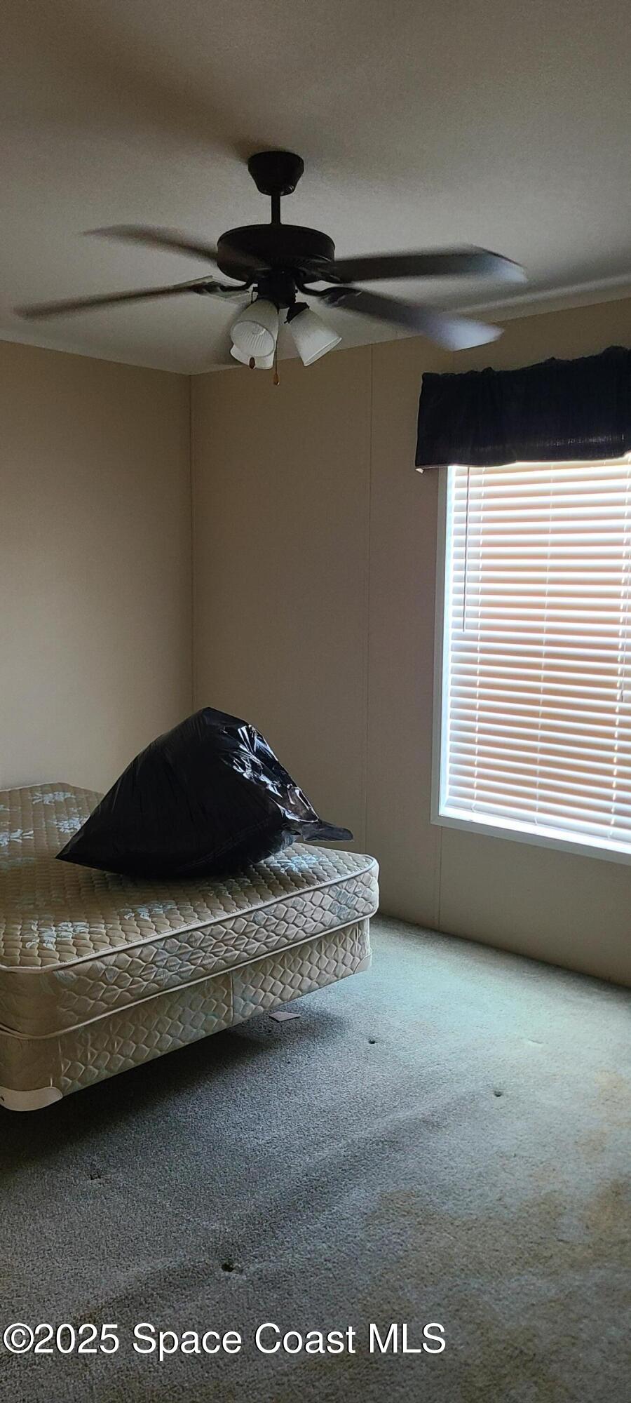 17189 County Road 252 Live Oak, FL 32060 - Photo 17 of 31 a bedroom with a bed and a window